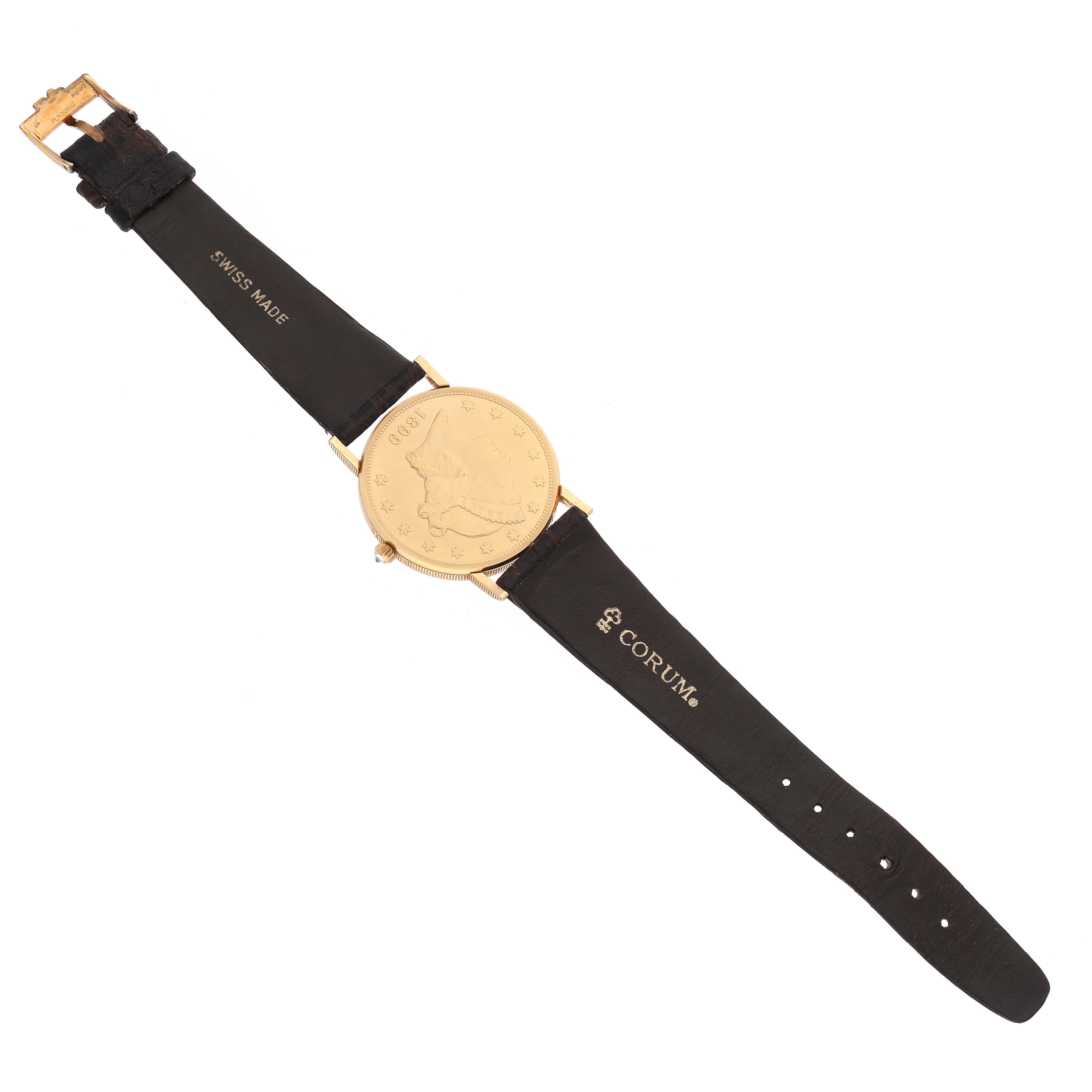 The image shows a top-down view of a Corum Coin Watch 4414556 Men's Yellow Gold Champagne Dial 4414556 Men's Yellow Gold Champagne Dial with its circular face and black leather straps fully extended.