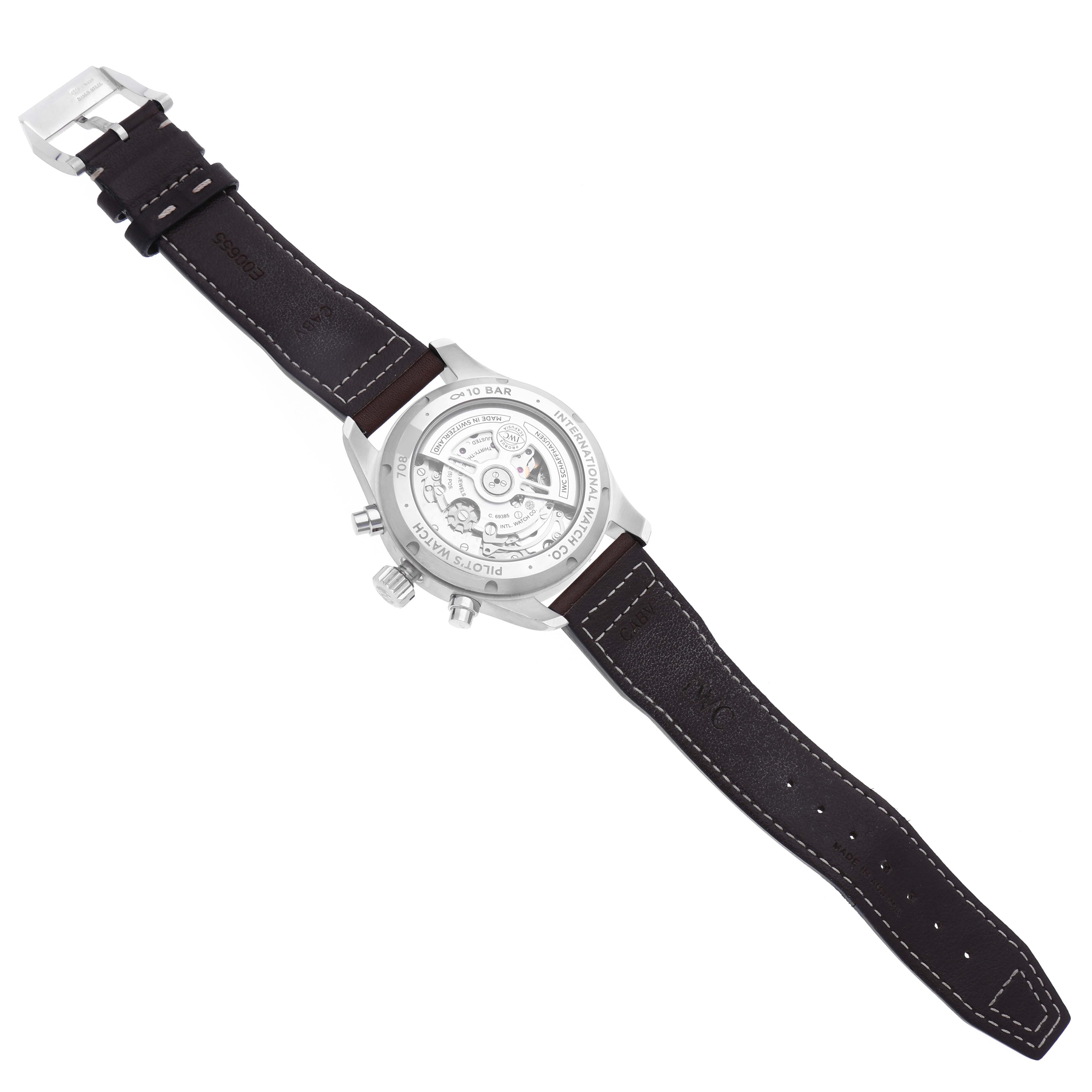 The image shows the back of the IWC Pilot IW388103 Men's Stainless Steel Green Dial IW388103 Men's Stainless Steel Green Dial watch, displaying its movement and leather strap.