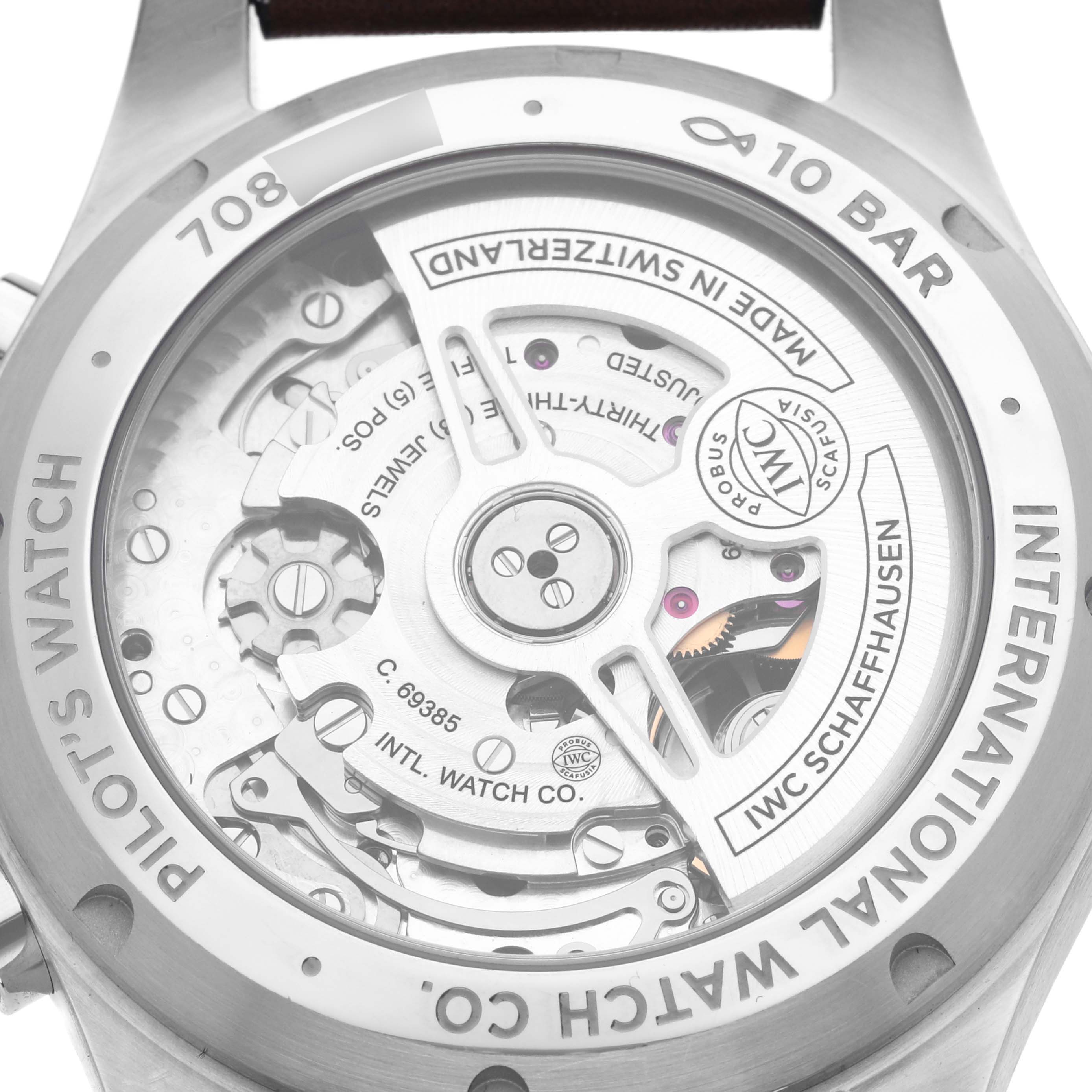 The image shows the back of an IWC Pilot IW388103 Men's Stainless Steel Green Dial IW388103 Men's Stainless Steel Green Dial watch, highlighting its intricate movement and components.