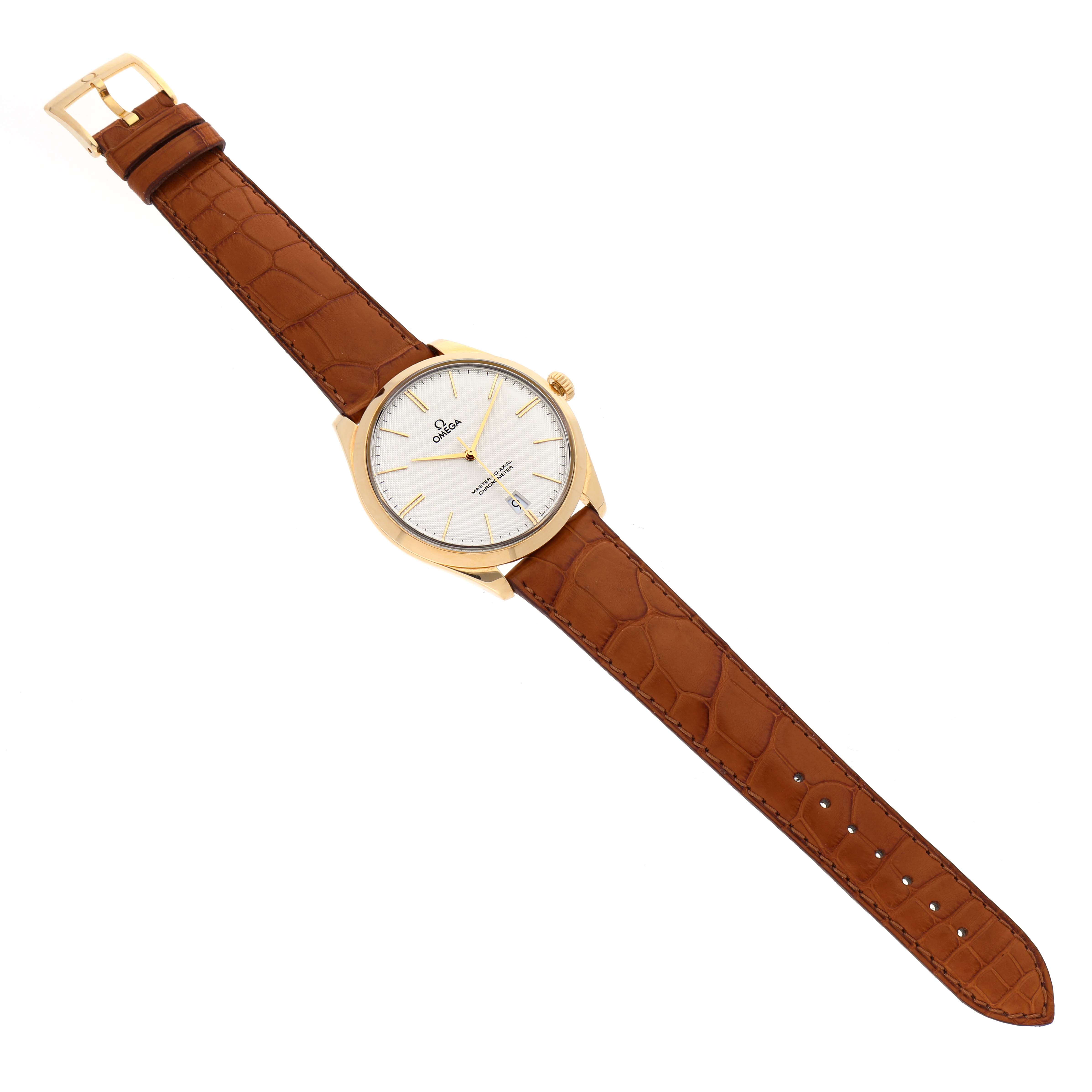 The image shows a top view of the Omega De Ville 432.53.40.21.02.001 Men's Yellow Gold Silver Dial 432.53.40.21.02.001 Men's Yellow Gold Silver Dial watch with a white dial and brown leather strap fully extended.