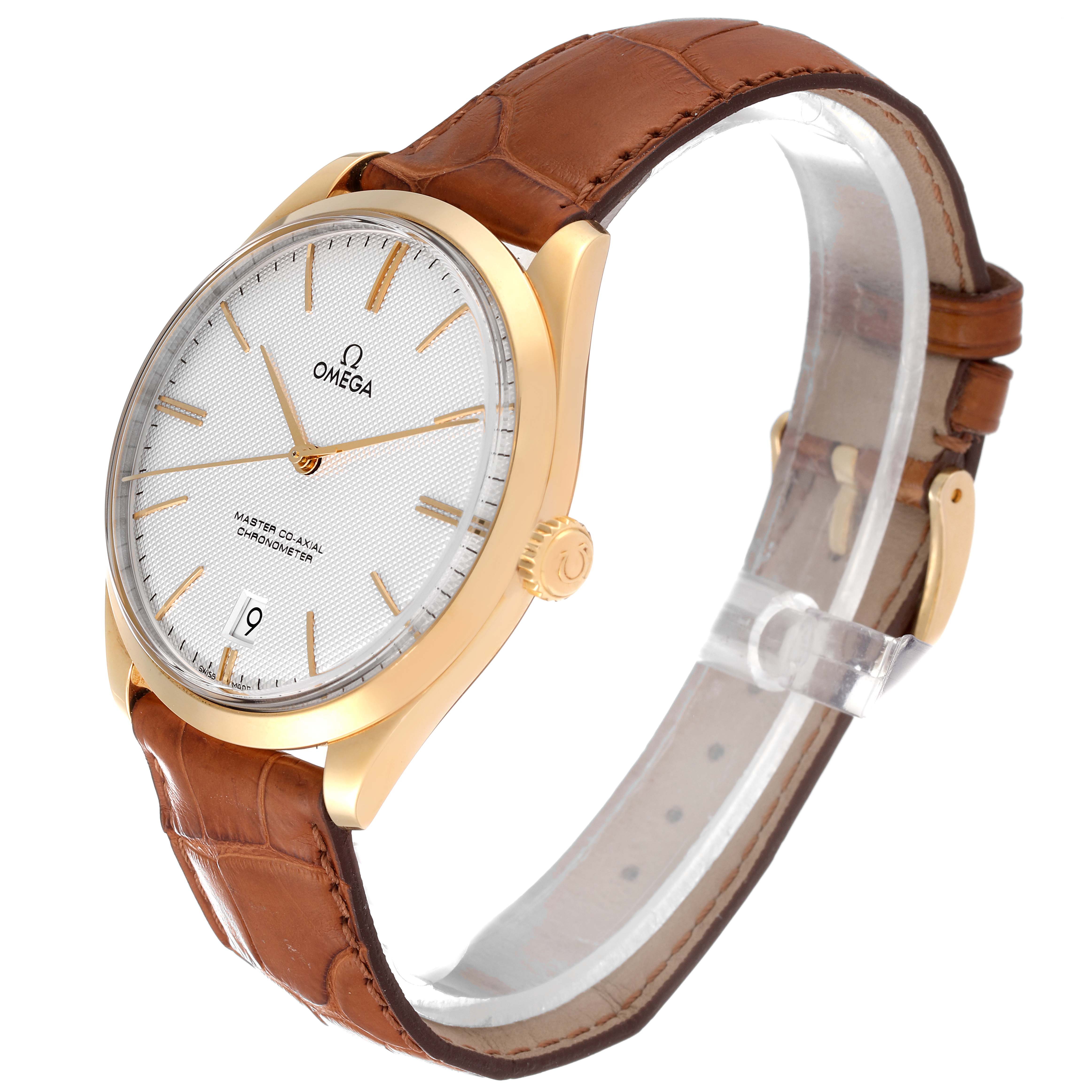 The Omega De Ville 432.53.40.21.02.001 Men's Yellow Gold Silver Dial 432.53.40.21.02.001 Men's Yellow Gold Silver Dial watch is shown from a side angle, displaying the face, crown, case, and leather strap.