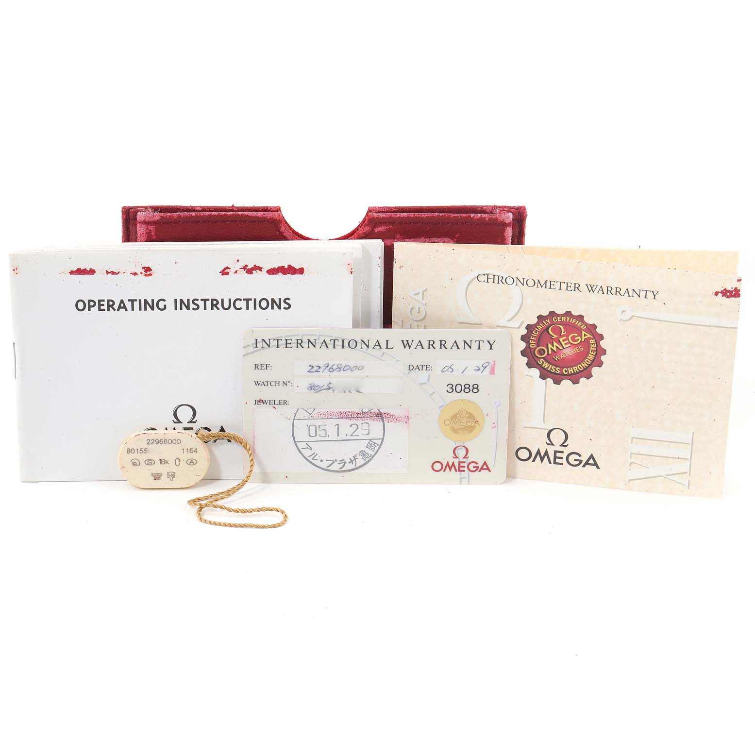 The image shows an Omega Seamaster 2296.80.00 Men's Titanium Blue Dial 2296.80.00 Men's Titanium Blue Dial model's operating instructions, warranty cards, and tags from a frontal angle.