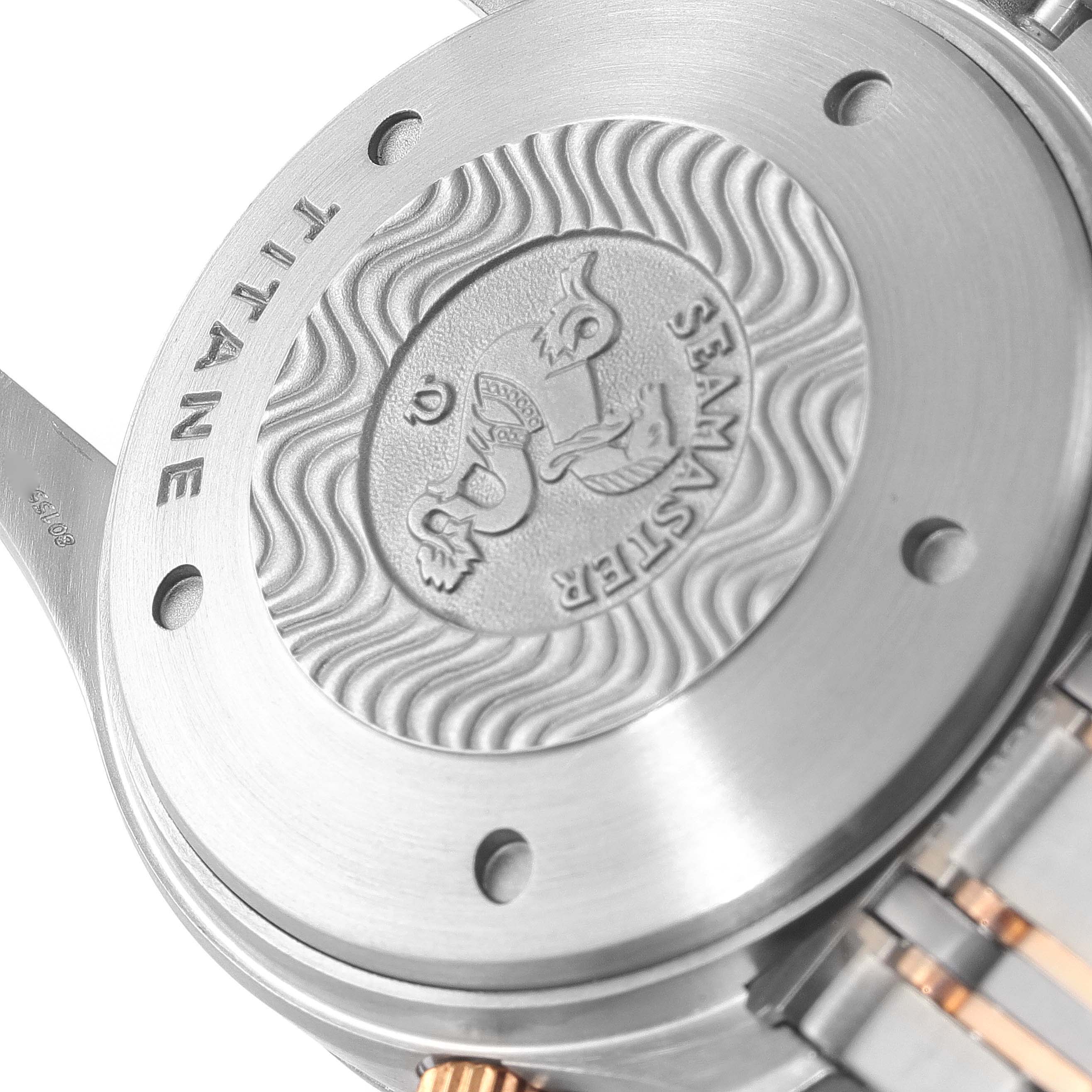 The image shows the back case and part of the bracelet of the Omega Seamaster 2296.80.00 Men's Titanium Blue Dial 2296.80.00 Men's Titanium Blue Dial watch, highlighting the embossed emblem and "TITANE" inscription.