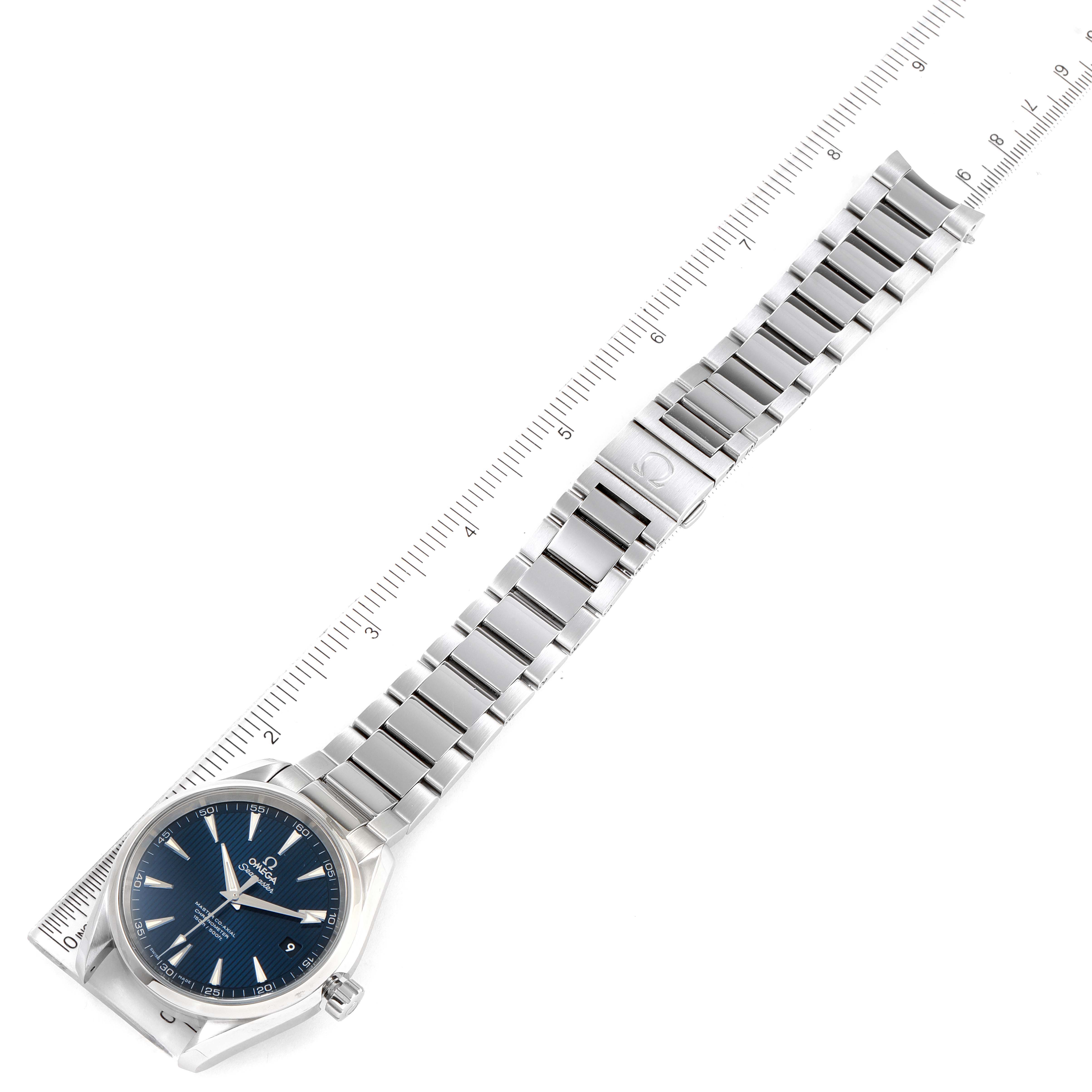 The Omega Aqua Terra 231.10.42.21.03.003 Men
s Stainless Steel Blue Dial 231.10.42.21.03.003 Men
s Stainless Steel Blue Dial watch is shown from a top-down angle, displaying the face, bracelet, and part of a ruler for scale.