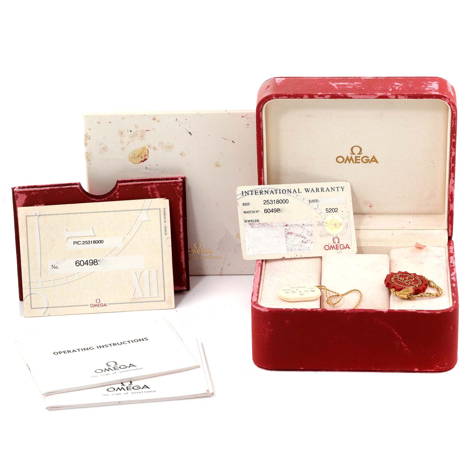 The image shows an Omega Seamaster 2531.80.00 Men's Stainless Steel Blue Dial 2531.80.00 Men's Stainless Steel Blue Dial watch box, operating instructions, warranty card, and a tag, all photographed from a front angle.