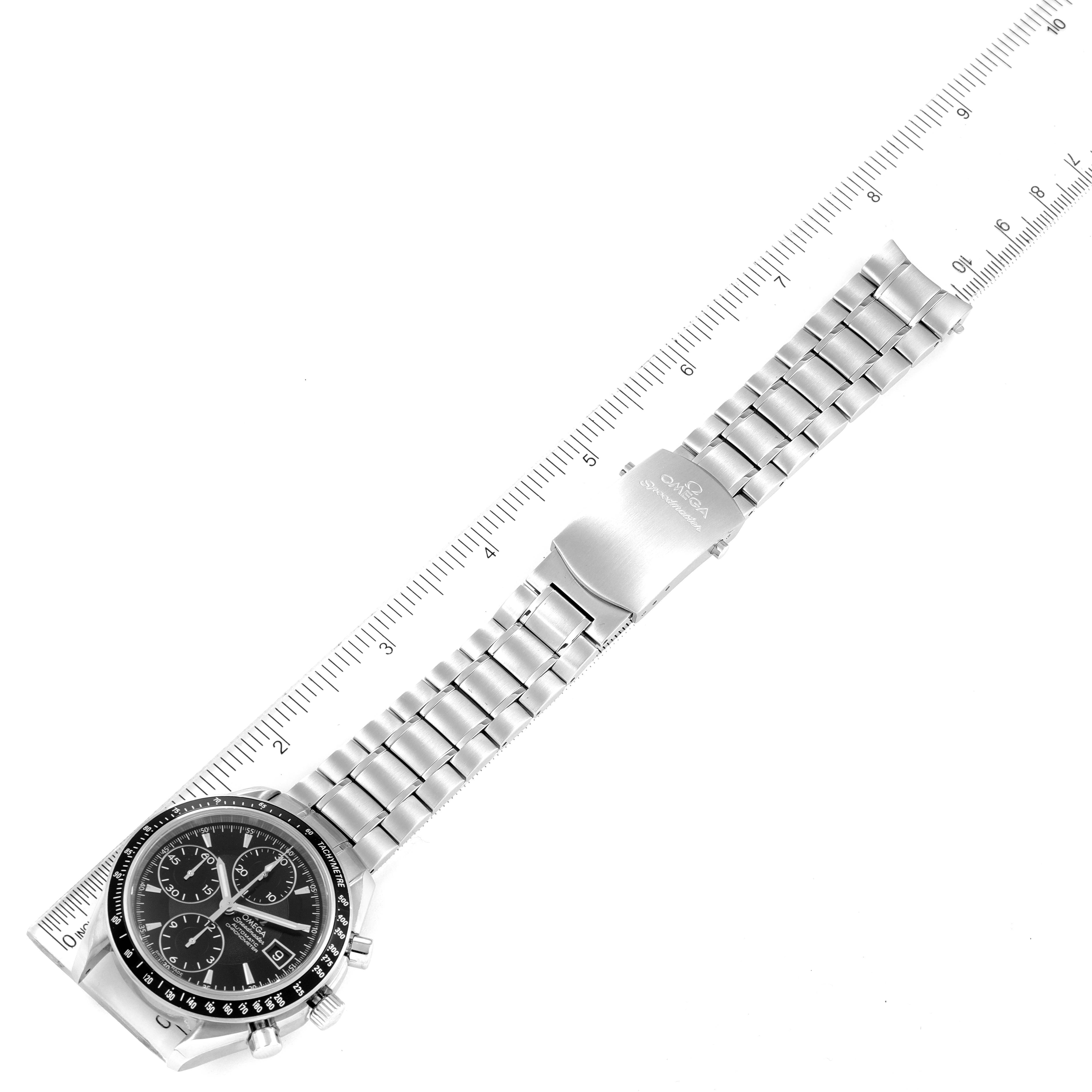 The Omega Speedmaster 3210.50.00 Men
s Stainless Steel Black Dial 3210.50.00 Men
s Stainless Steel Black Dial watch is shown flat, displaying the face, bezel, case, bracelet, and clasp alongside a ruler for scale.