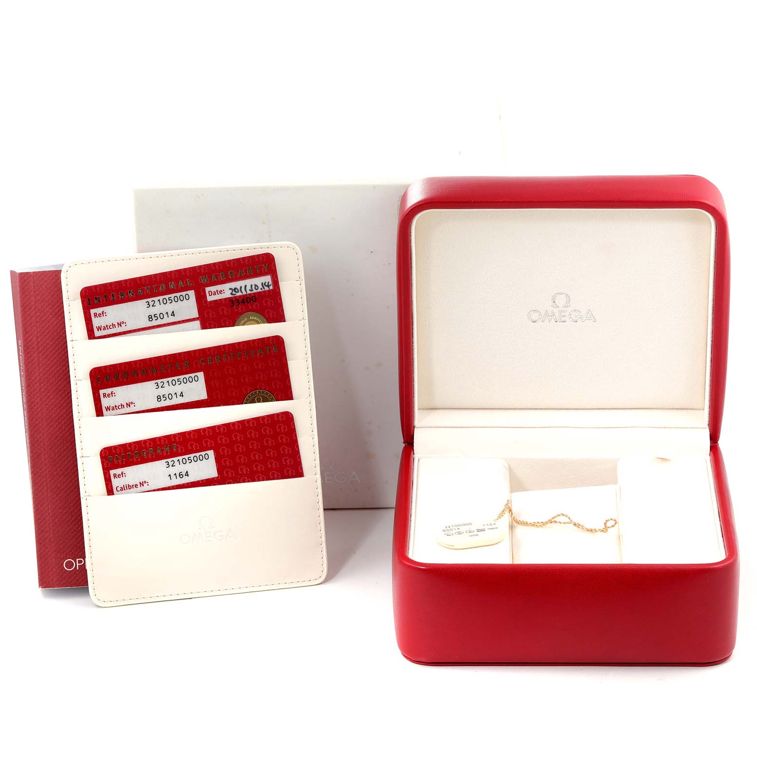 The image shows an open red Omega Speedmaster 3210.50.00 Men
s Stainless Steel Black Dial 3210.50.00 Men
s Stainless Steel Black Dial box, accompanying cards in holders, and a booklet.