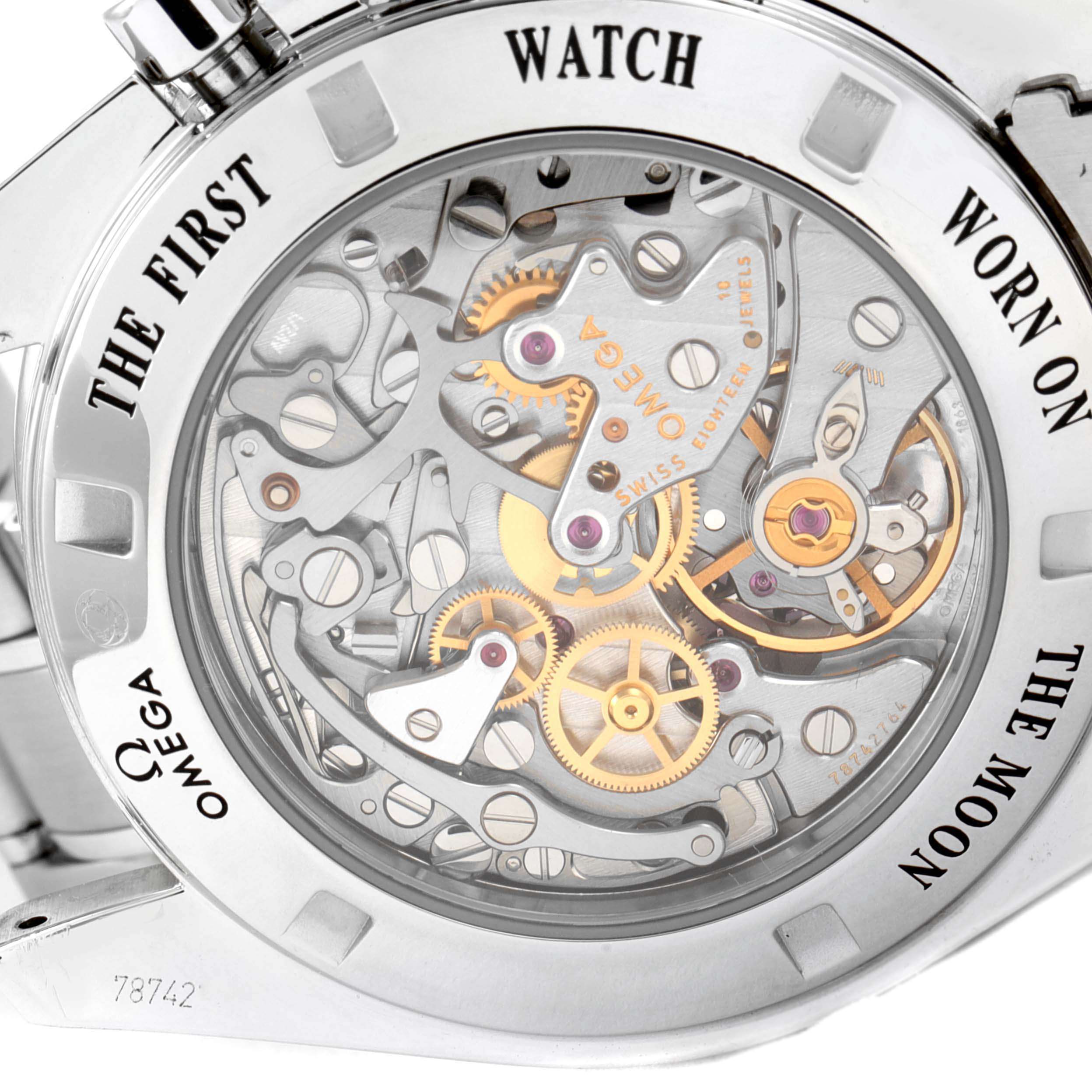 The image shows the back view of the Omega Speedmaster 311.30.42.30.01.006 Men's Stainless Steel Black Dial 311.30.42.30.01.006 Men's Stainless Steel Black Dial watch, highlighting its intricate mechanical movement and inscriptions.