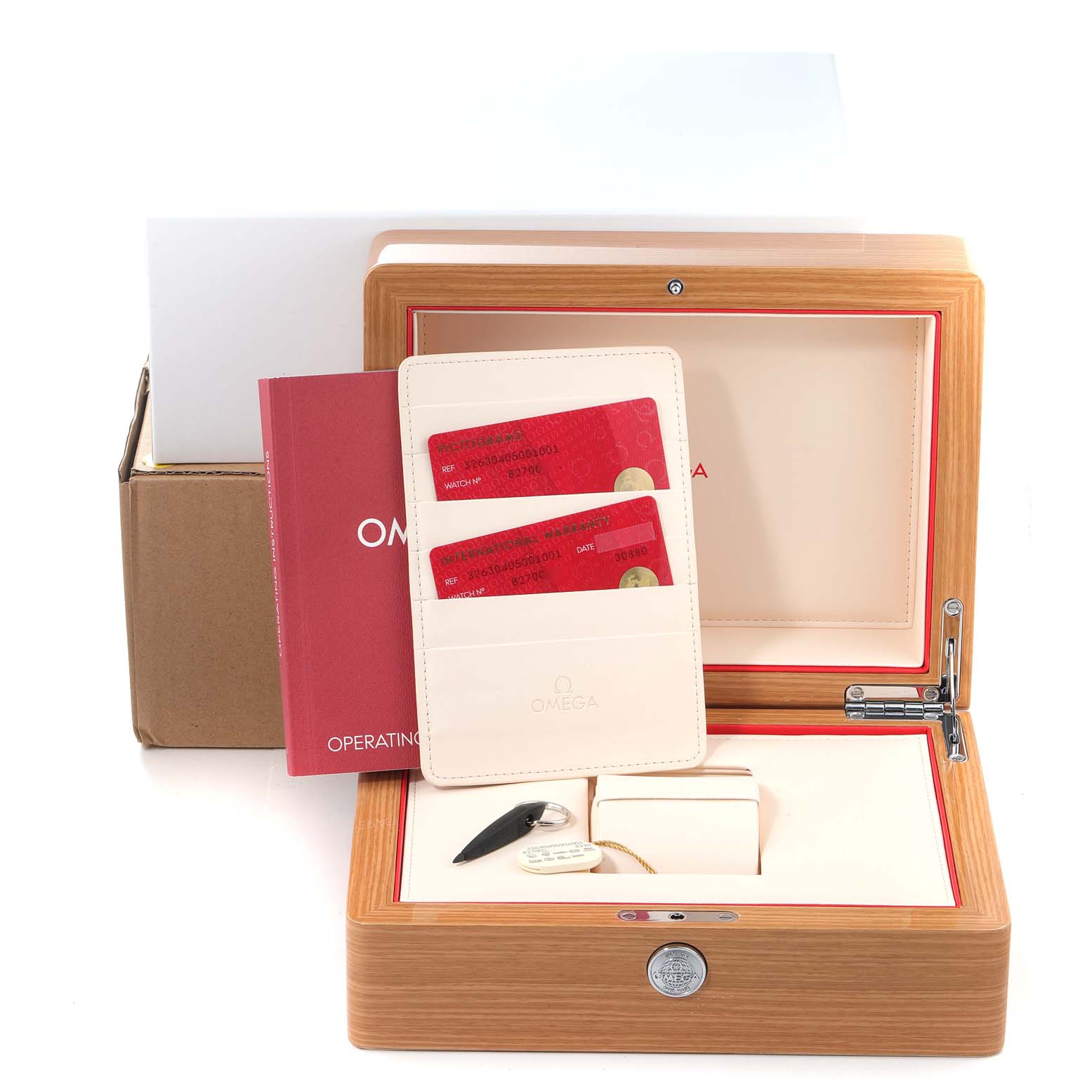 The image shows the packaging, accessories, and documents for an Omega Speedmaster 326.30.40.50.01.001 Men's Stainless Steel Black Dial 326.30.40.50.01.001 Men's Stainless Steel Black Dial watch from a front angle.