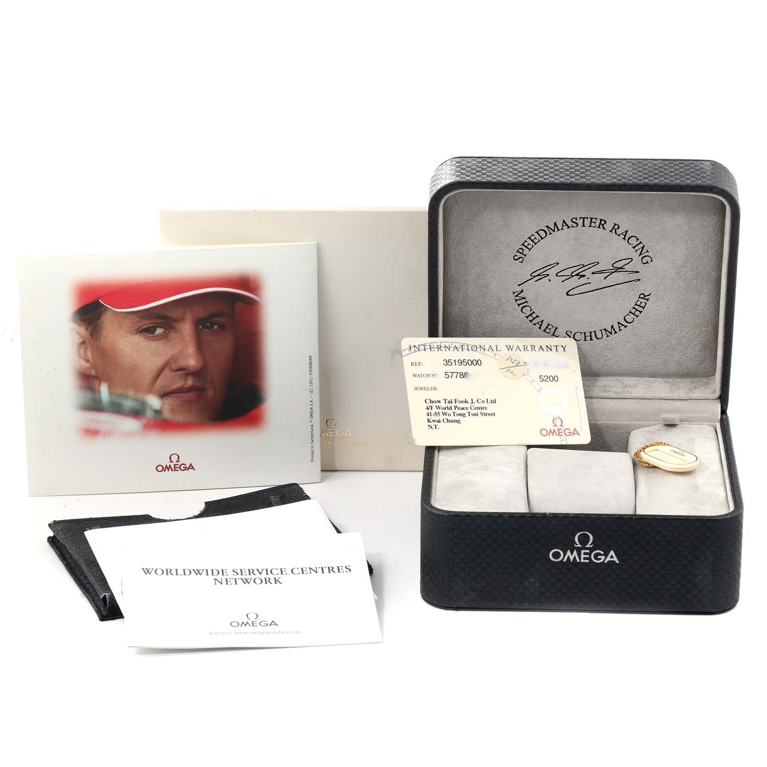 The image shows the Omega Speedmaster 3519.50.00 Men's Stainless Steel Black Dial 3519.50.00 Men's Stainless Steel Black Dial box, international warranty card, booklet, and service centers pamphlet.