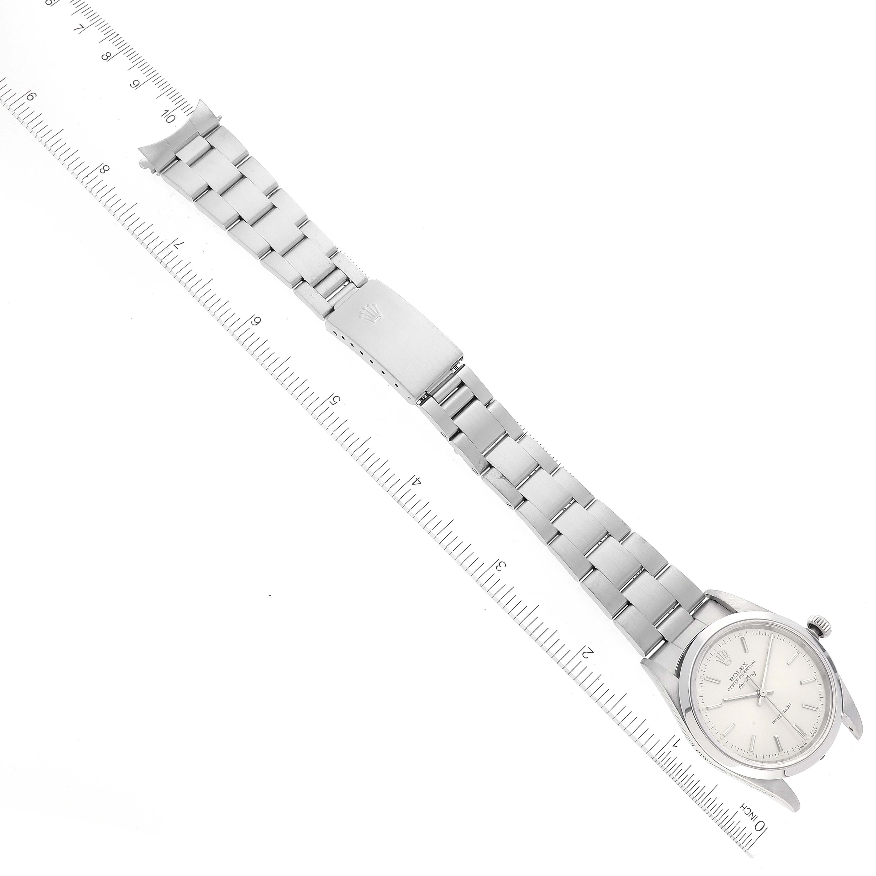The image shows a full-length view of a Rolex Air-King 14000 Men's Stainless Steel Silver Dial 14000 Men's Stainless Steel Silver Dial watch, including the dial, bracelet, and clasp, with a ruler for scale.