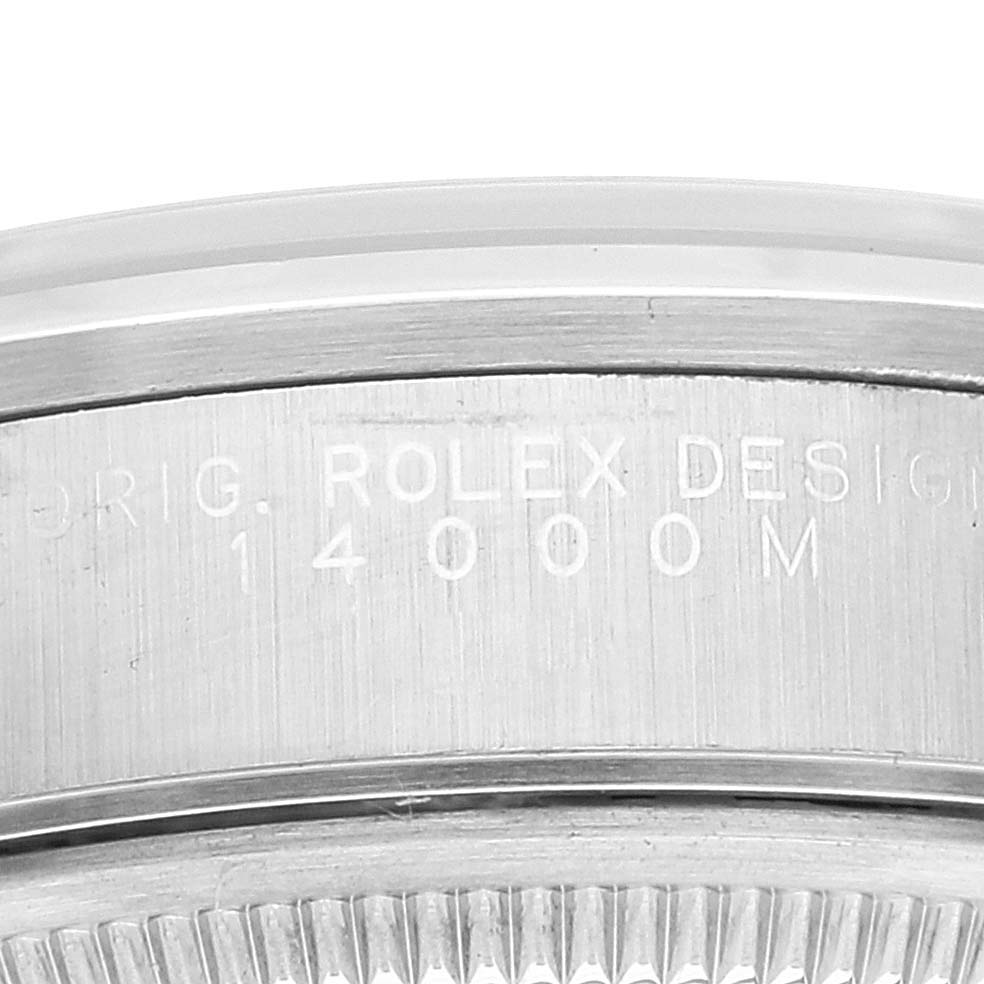 Close-up of the case side of the Rolex Air-King 14000 Men's Stainless Steel Silver Dial 14000 Men's Stainless Steel Silver Dial, showing engraved text "ORIG. ROLEX DESIGN 14000M".