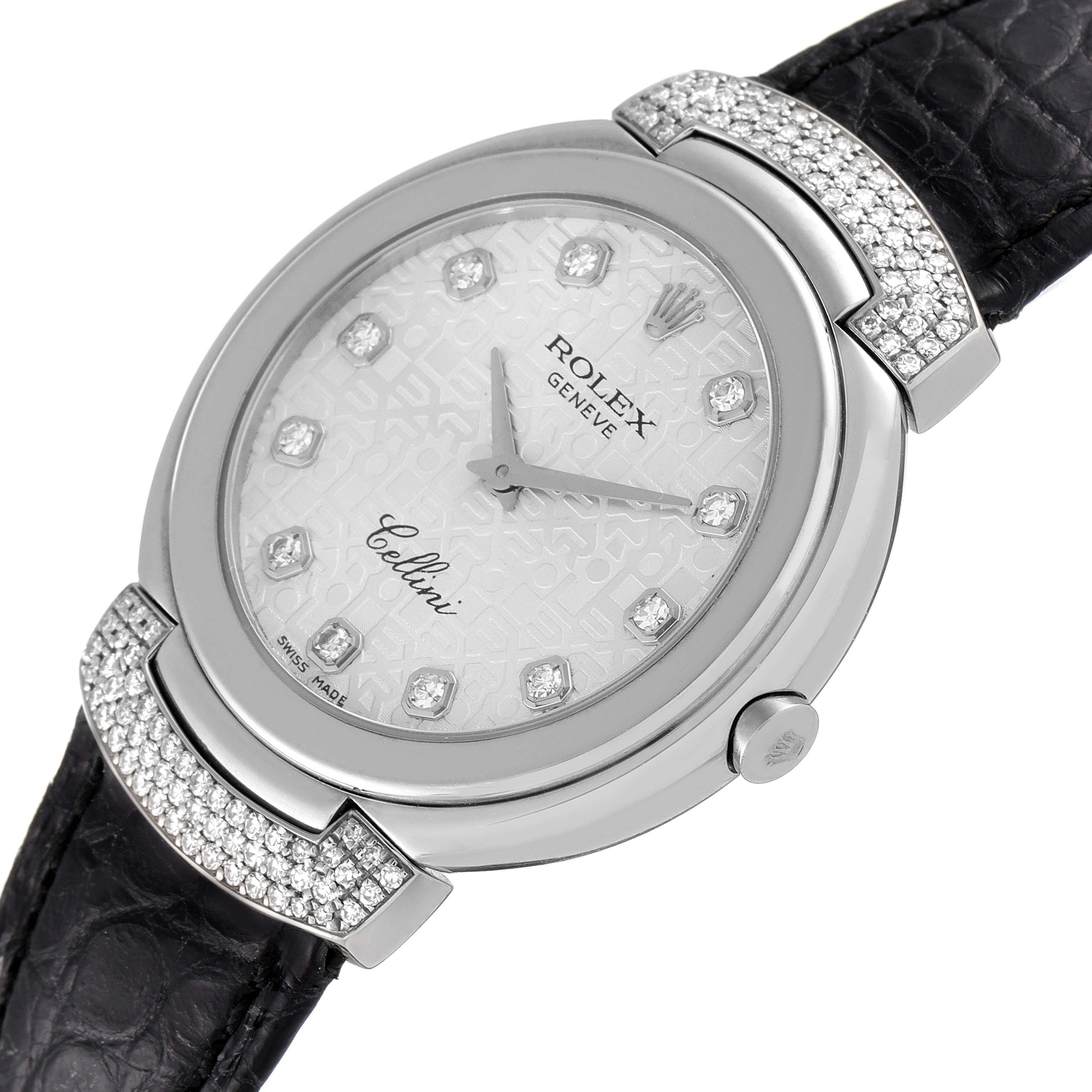 The image shows a close-up of the dial and part of the strap of a Rolex Cellini 6682/9 Women's White Gold Silver Dial 6682/9 Women's White Gold Silver Dial watch, featuring a diamond-studded bezel.