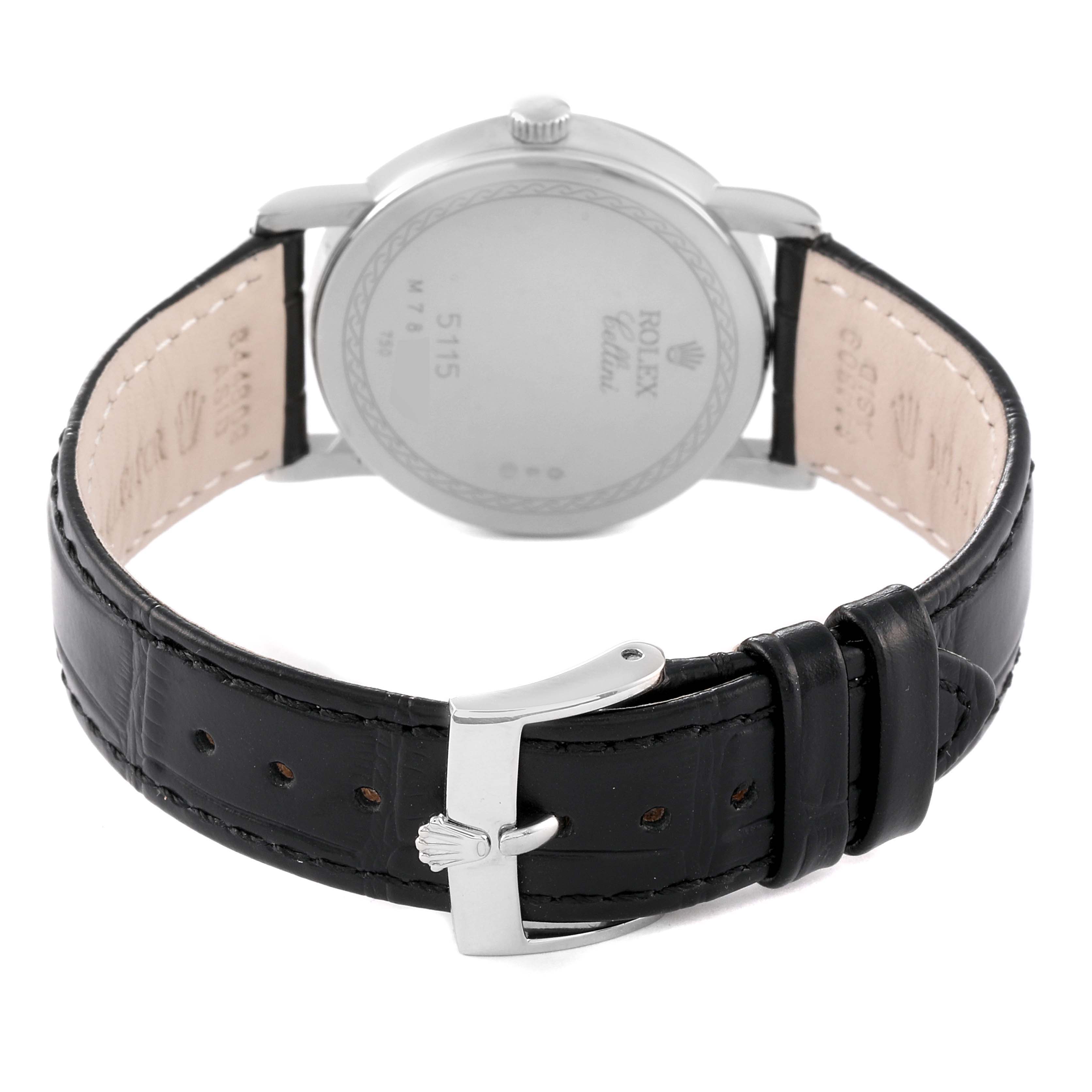 The image shows the back of a Rolex Cellini 5115/9 Men
s White Gold Silver Dial 5115/9 Men
s White Gold Silver Dial watch, highlighting the case back and black leather strap with the buckle.
