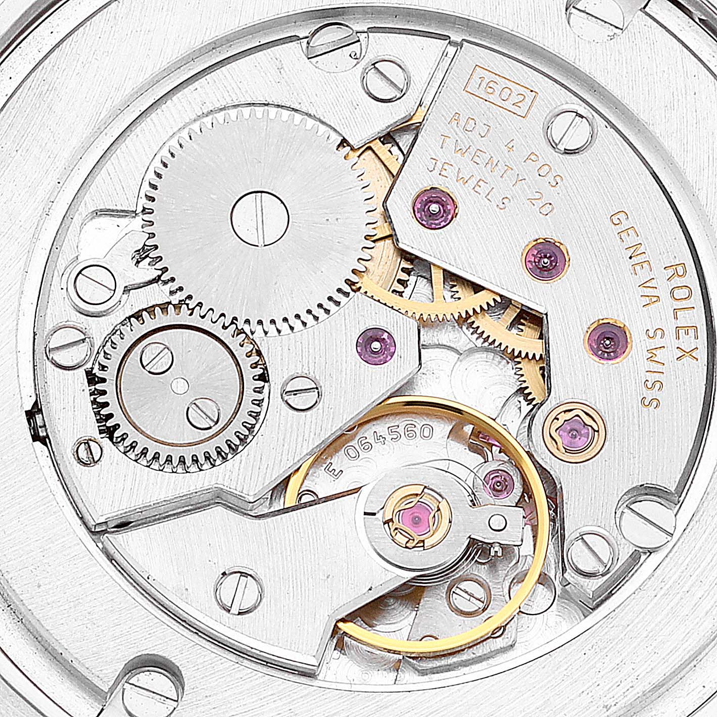 This is a close-up view of the intricate inner mechanism of a Rolex Cellini 5115/9 Men
s White Gold Silver Dial 5115/9 Men
s White Gold Silver Dial watch, showing gears, jewels, and inscriptions.
