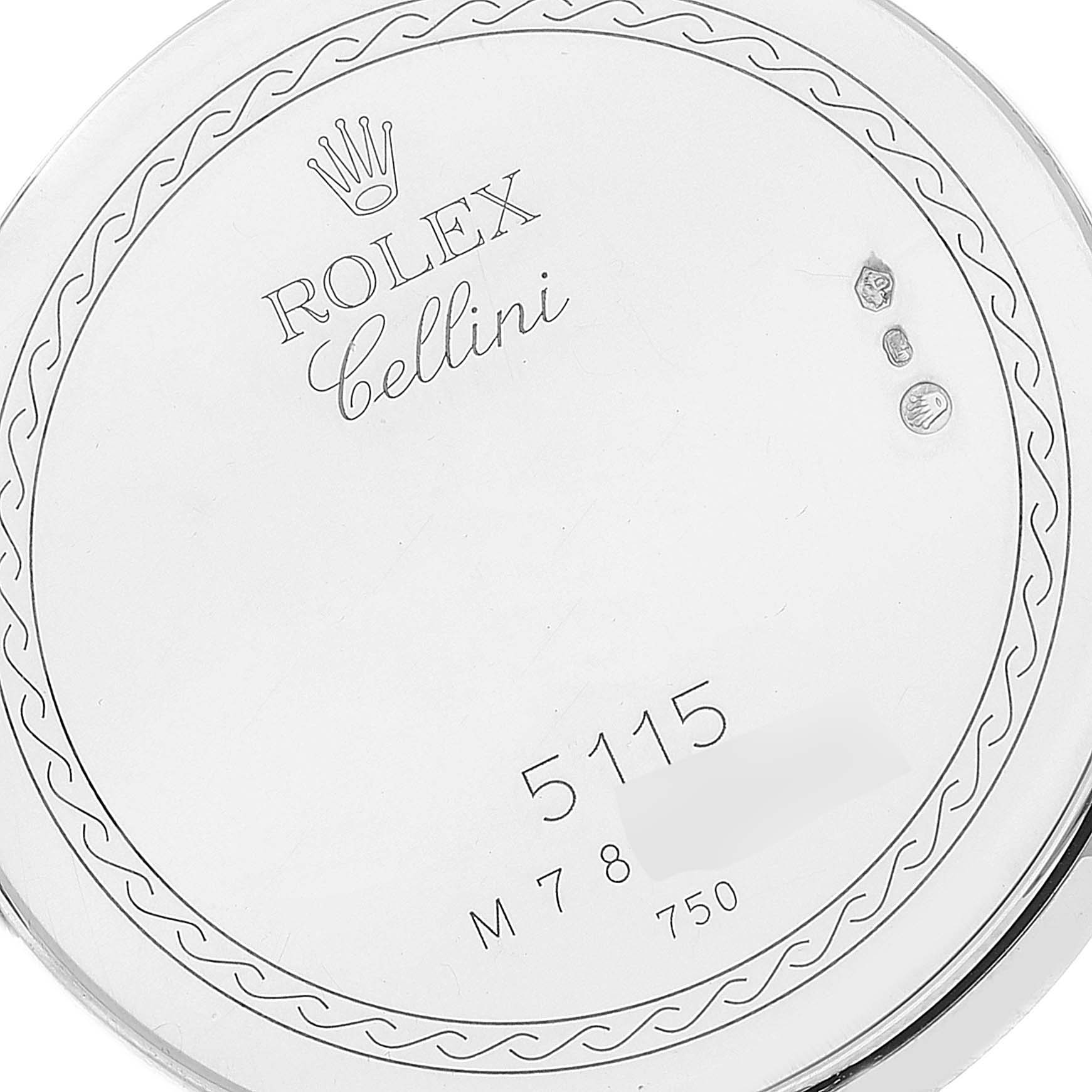 This is a close-up view of the back casing of a Rolex Cellini 5115/9 Men
s White Gold Silver Dial 5115/9 Men
s White Gold Silver Dial watch, showing the engraved details and model number.