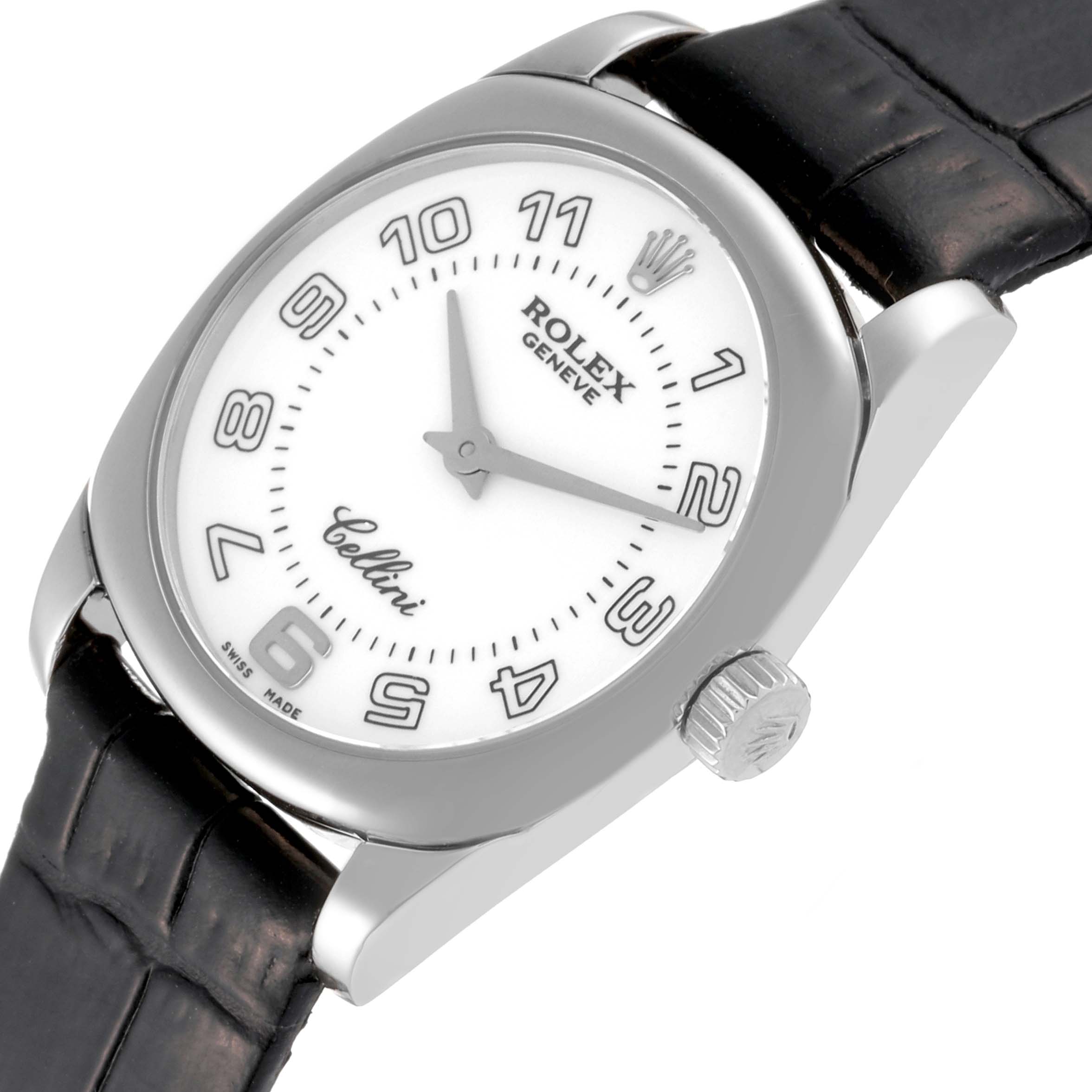 The Rolex Cellini 6229 Women's White Gold White Dial 6229 Women's White Gold White Dial watch is shown at a slightly tilted angle, displaying its dial, crown, and part of the leather strap.