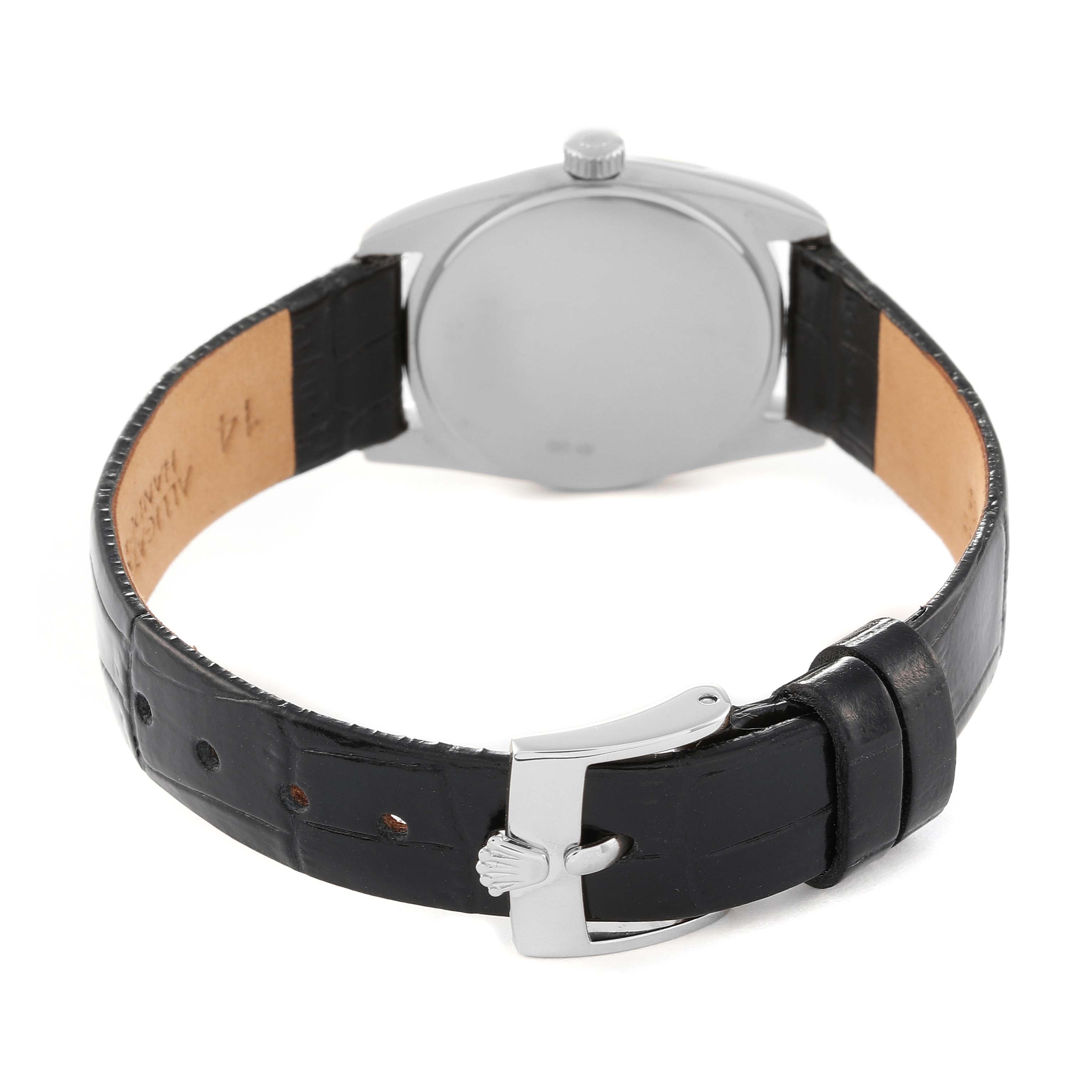 The image shows the back case and leather strap of the Cellini model by Rolex from a rear angle.