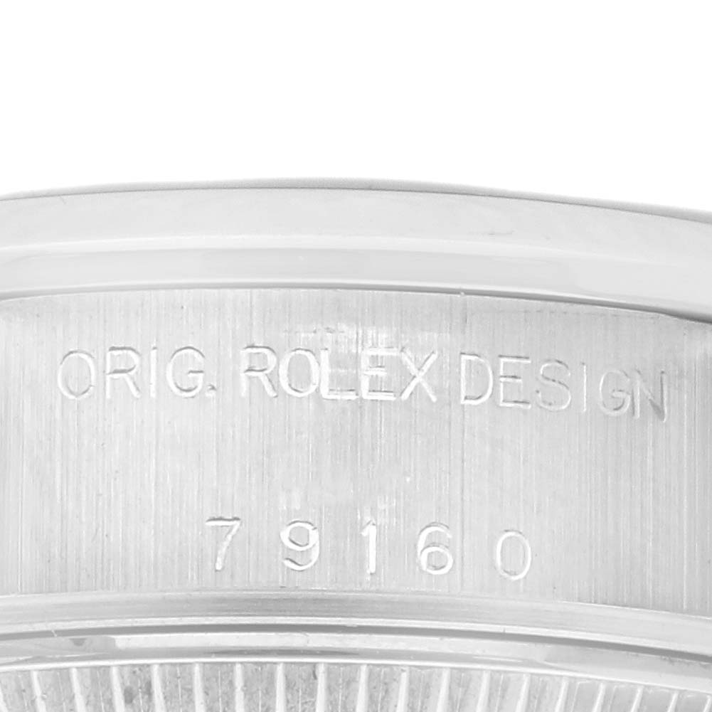 The image shows the side of the Rolex Date 79160 Women's Stainless Steel Pink Dial 79160 Women's Stainless Steel Pink Dial watch, focusing on the engraved design and model number "79160."