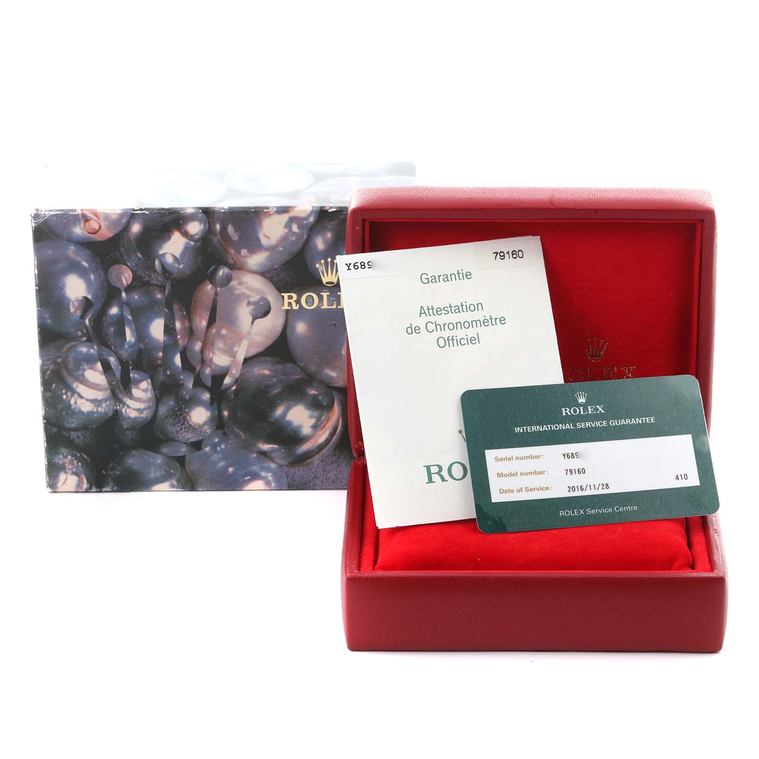 The image shows a Rolex Date 79160 Women's Stainless Steel Pink Dial 79160 Women's Stainless Steel Pink Dial model's box, manuals, and service guarantee card.