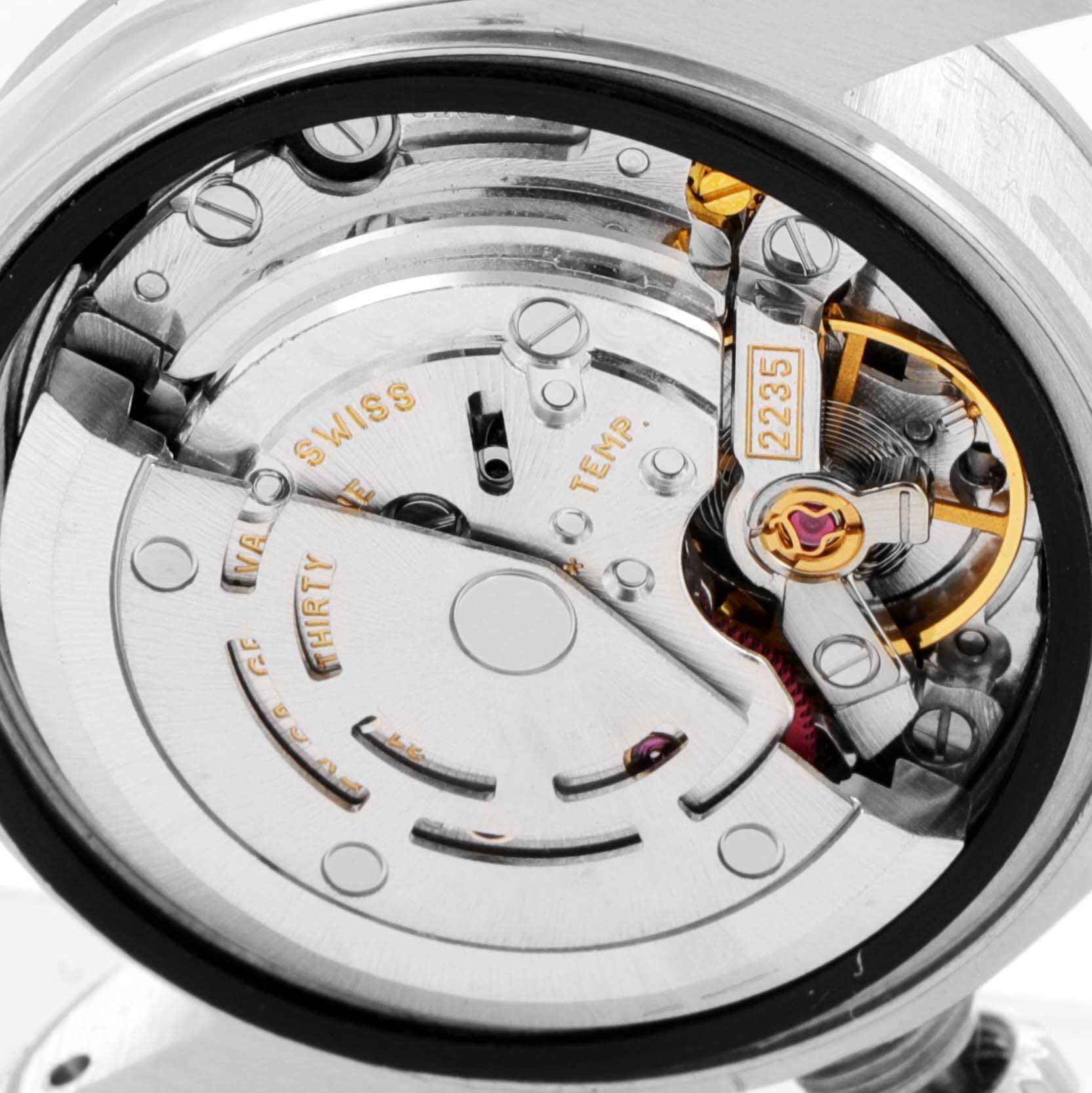 This close-up angle of the Rolex Date 79190 Women's Stainless Steel Black Dial 79190 Women's Stainless Steel Black Dial model shows the intricate details of its movement, specifically the rotor and balance wheel.