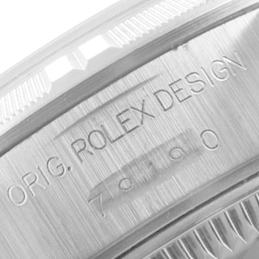 The image shows the engraved side and bezel of the Rolex Date 79190 Women's Stainless Steel Black Dial 79190 Women's Stainless Steel Black Dial model watch.