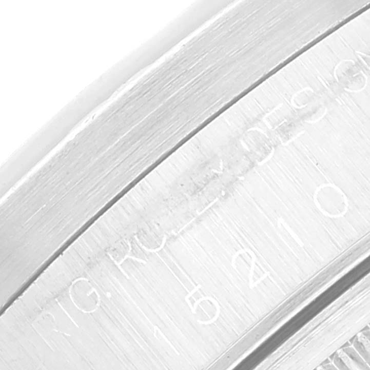 This close-up image shows the side engraving on the watch case edge of a Rolex Date 15210 Men
s Stainless Steel Black Dial 15210 Men
s Stainless Steel Black Dial model.