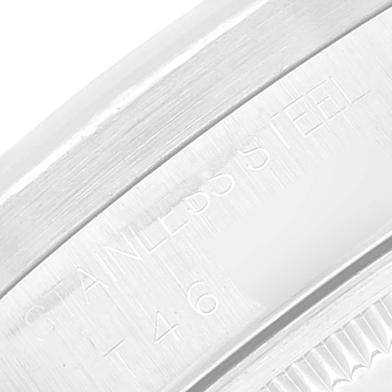 Close-up of the stainless steel case side of a Rolex Date 15210 Men
s Stainless Steel Black Dial 15210 Men
s Stainless Steel Black Dial model watch showing engraved text.