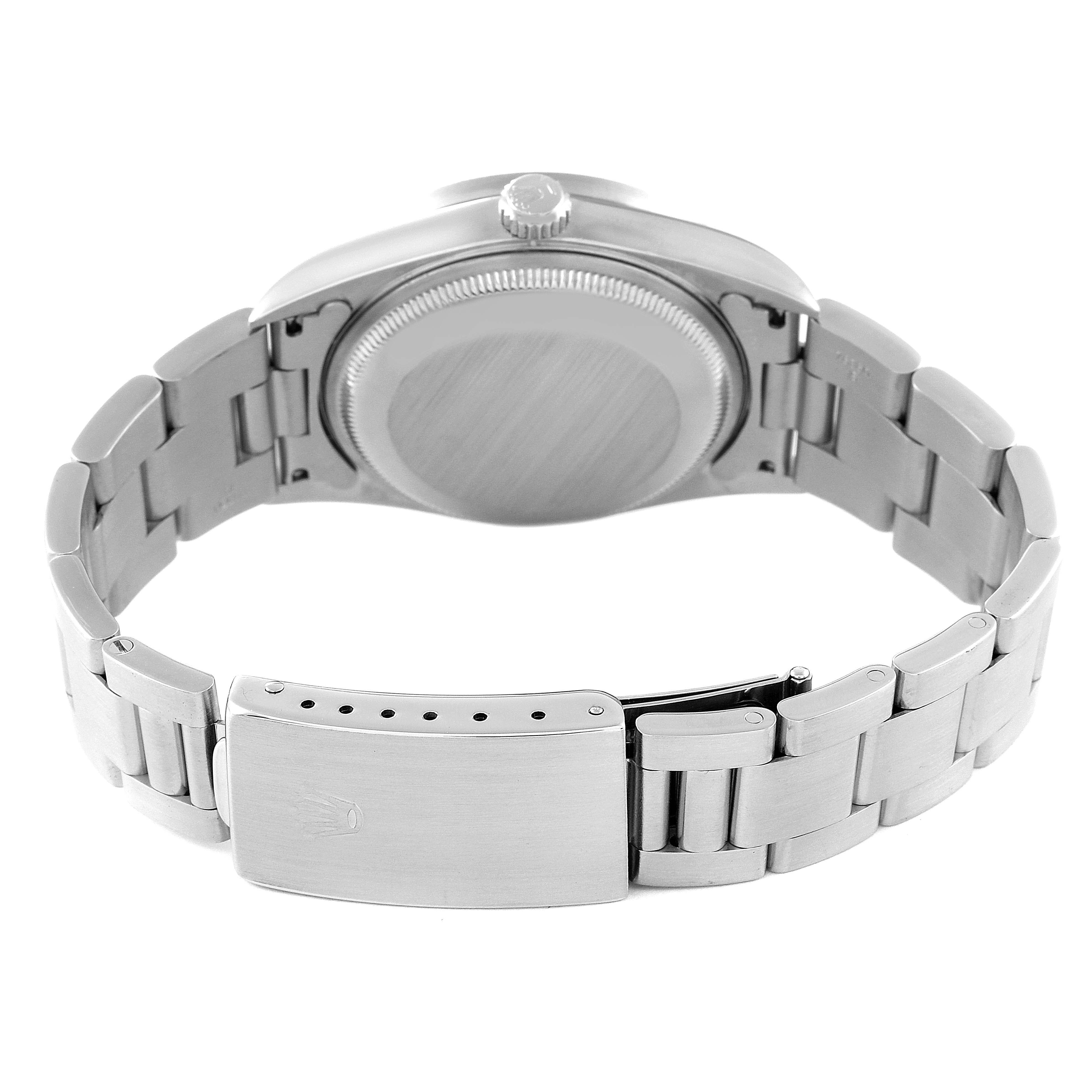 This image shows the Rolex Date 15210 Men
s Stainless Steel Black Dial 15210 Men
s Stainless Steel Black Dial watch from the back, featuring the case, crown, and bracelet clasp.