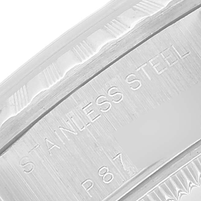 Close-up of the inner bezel of a Rolex Date 79240 Women's Stainless Steel Pink Dial 79240 Women's Stainless Steel Pink Dial watch, showing "STAINLESS STEEL" engraving and a partial serial number.