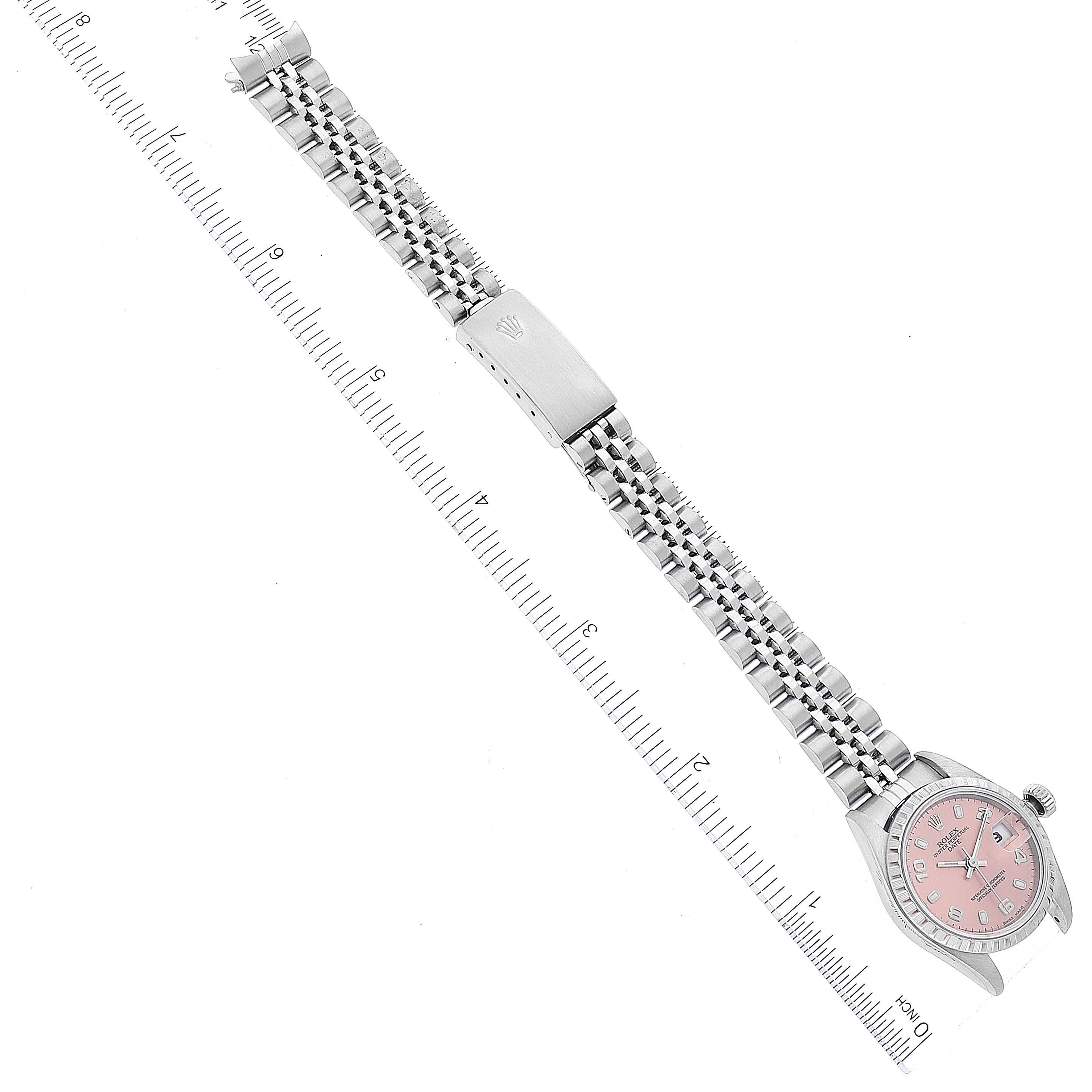 The image shows an overhead view of a Rolex Date 79240 Women's Stainless Steel Pink Dial 79240 Women's Stainless Steel Pink Dial model watch, highlighting its pink dial, stainless steel bracelet, and clasp.