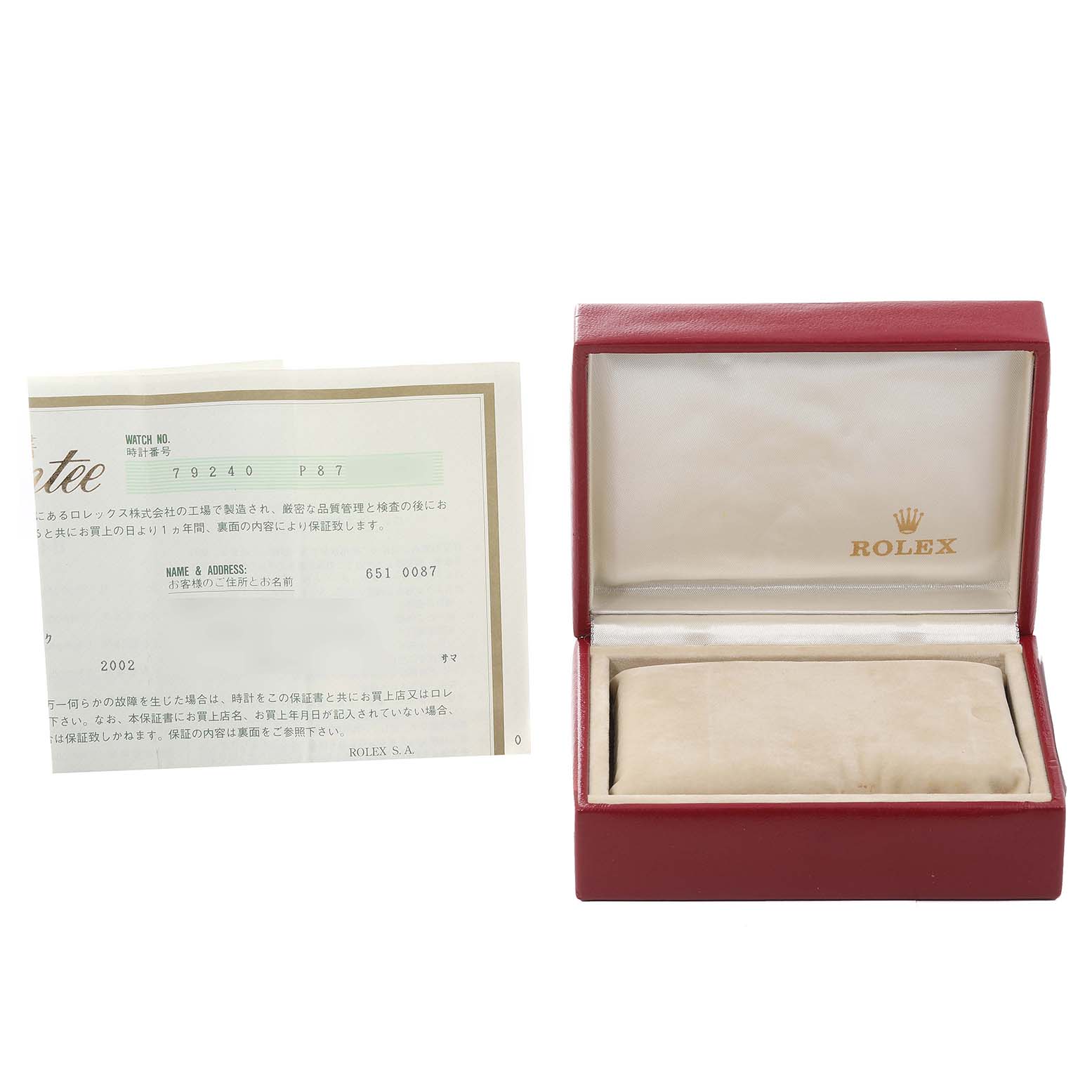 This image shows the open case of a Rolex Date 79240 Women's Stainless Steel Pink Dial 79240 Women's Stainless Steel Pink Dial model watch at an angle, accompanied by its warranty and documents.