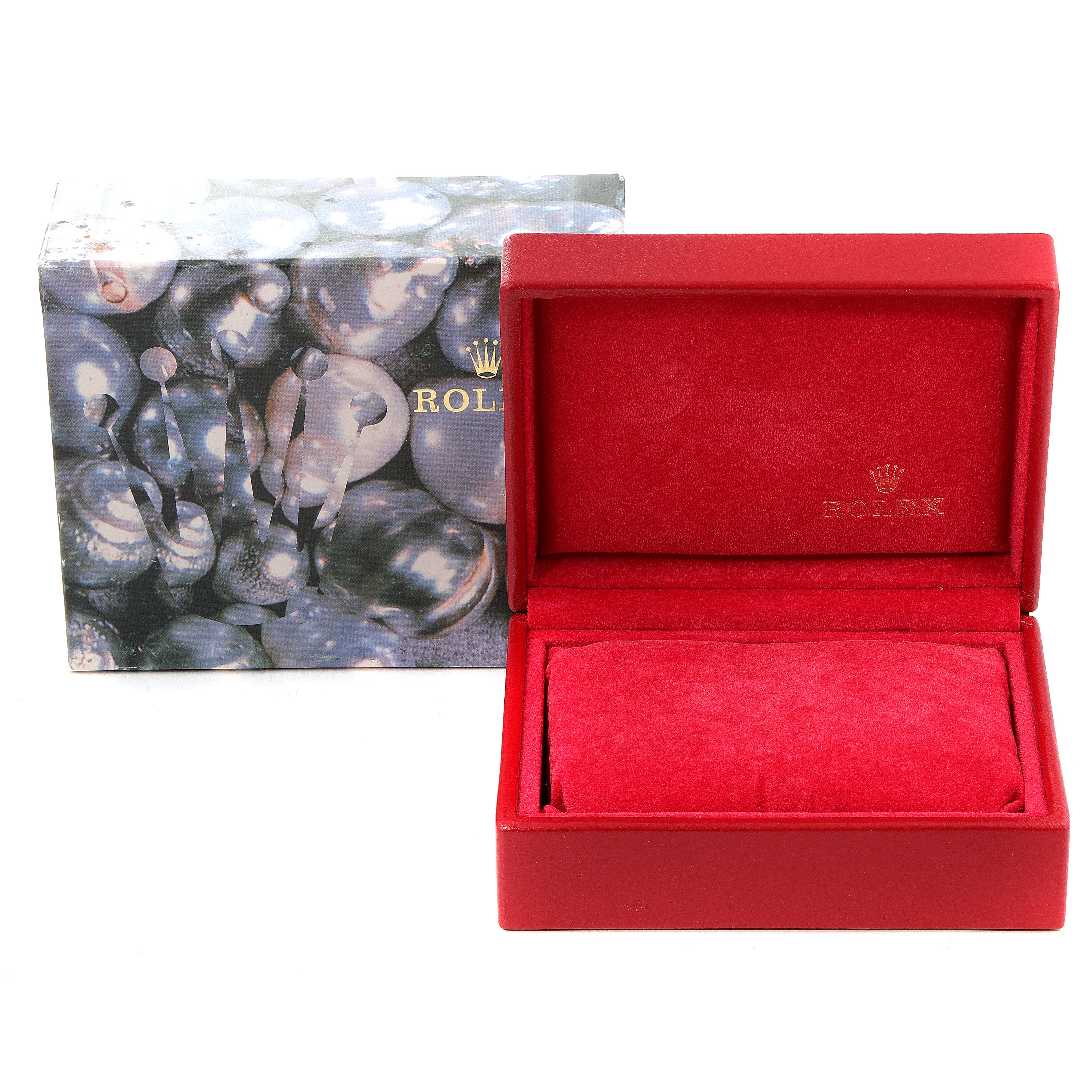 The image shows the packaging of a Rolex Datejust 69173 Women
s Steel and Gold (two tone) Champagne Dial 69173 Women
s Steel and Gold (two tone) Champagne Dial watch, featuring a decorative box and an open red interior box.