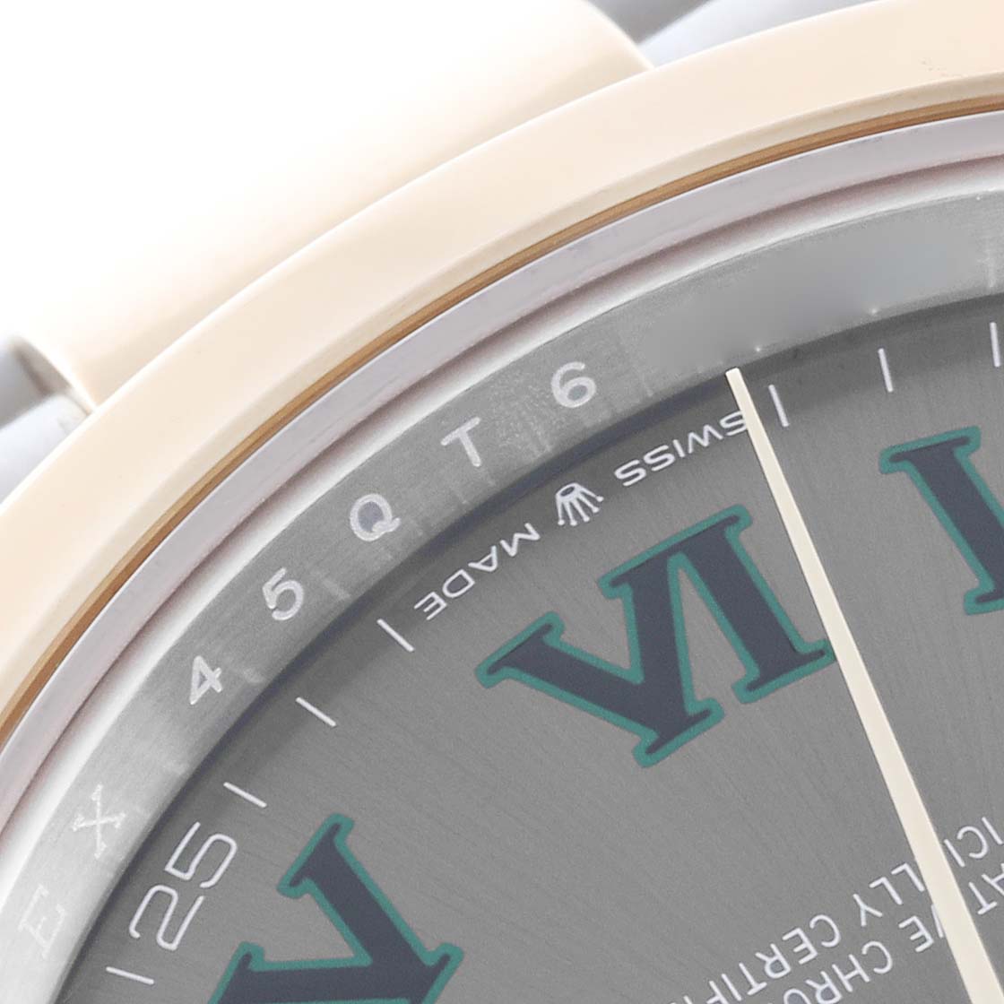 The image shows a close-up of the Rolex Datejust 41 126303 Men's Steel and Gold (two tone) Grey Dial 126303 Men's Steel and Gold (two tone) Grey Dial, focusing on the bezel, dial edge, and part of the hour hand.