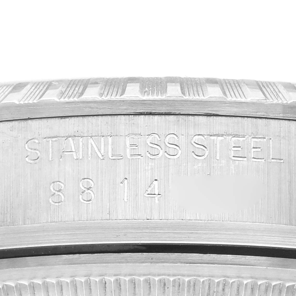 The image shows a close-up of the casing rim and engravings on a Rolex Datejust 16030 Men's Stainless Steel Silver Dial 16030 Men's Stainless Steel Silver Dial model.