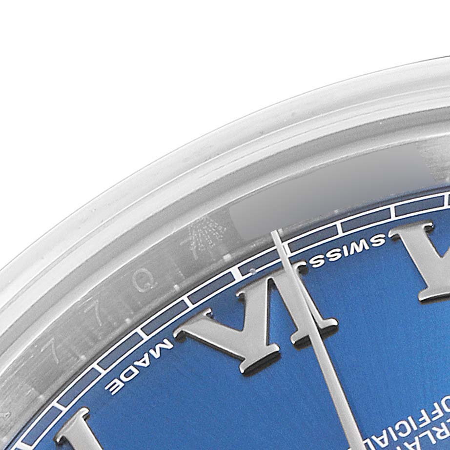 The image shows a close-up of the dial and part of the bezel of a Rolex Datejust 41 116300 Men
s Stainless Steel Blue Dial 116300 Men
s Stainless Steel Blue Dial watch, highlighting its blue face and Roman numerals.