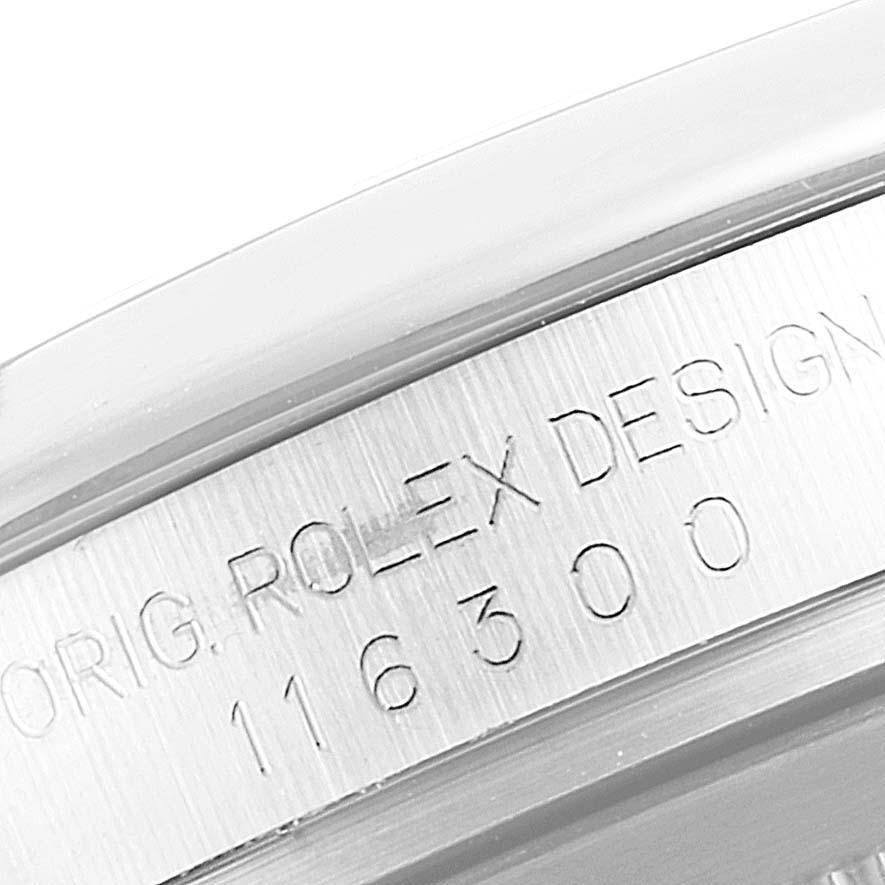 The image shows the serial number and model engraving on the side of the Rolex Datejust 41 116300 Men
s Stainless Steel Blue Dial 116300 Men
s Stainless Steel Blue Dial watch case.