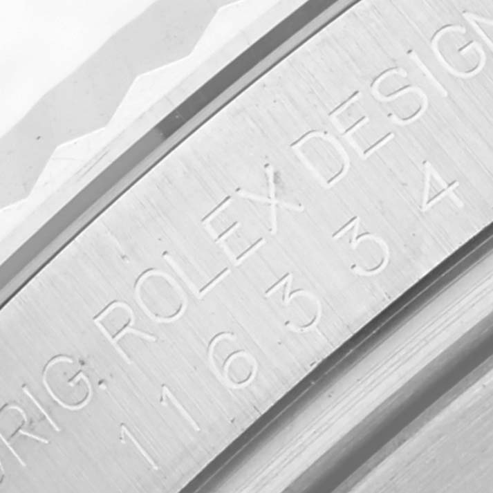 This image shows an up-close view of the engraved model and design details on the case of a Rolex Datejust 41 116334 Men's Stainless Steel Blue Dial 116334 Men's Stainless Steel Blue Dial watch.