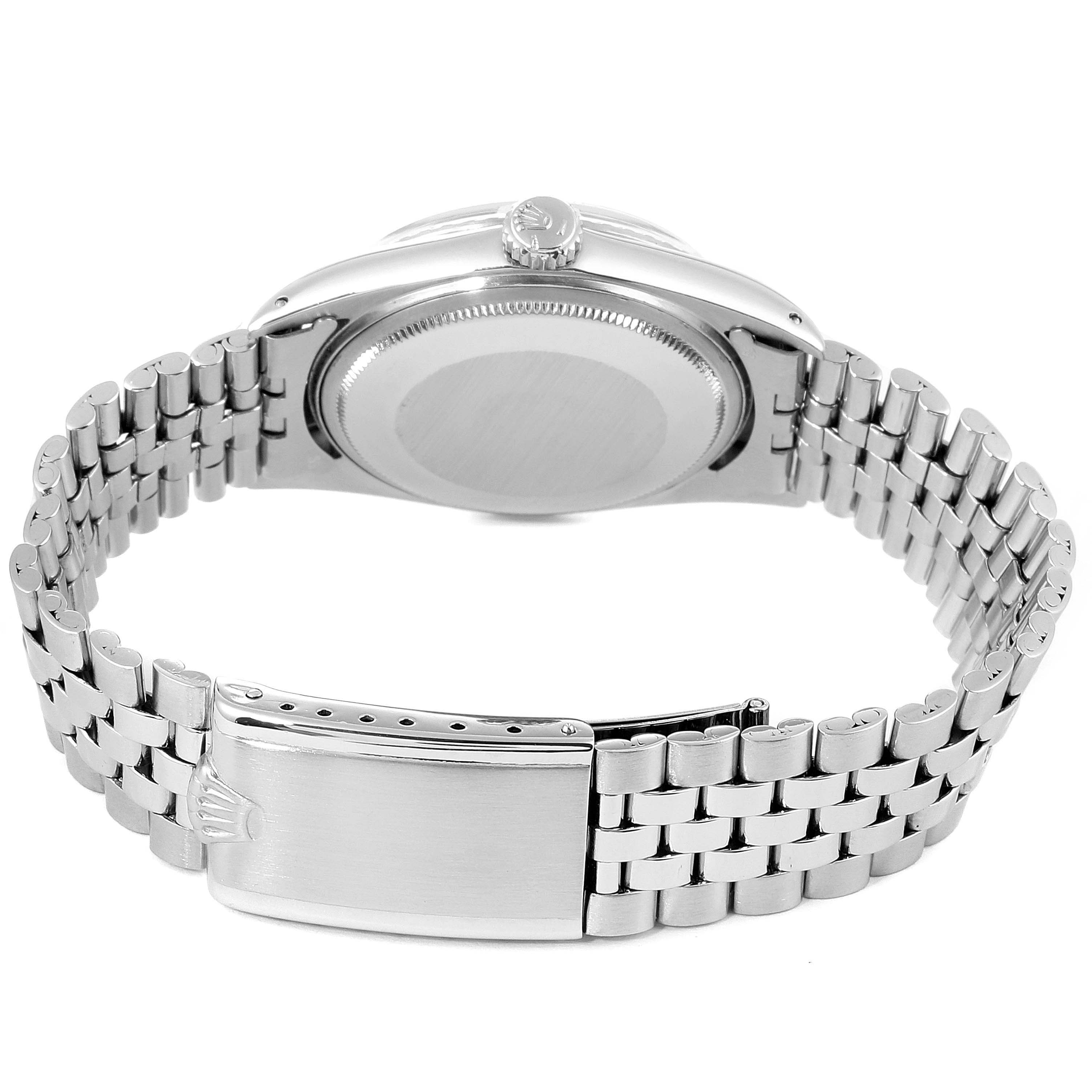 The image shows the back view of a Vintage Collection Rolex watch, highlighting its metal bracelet and clasp.