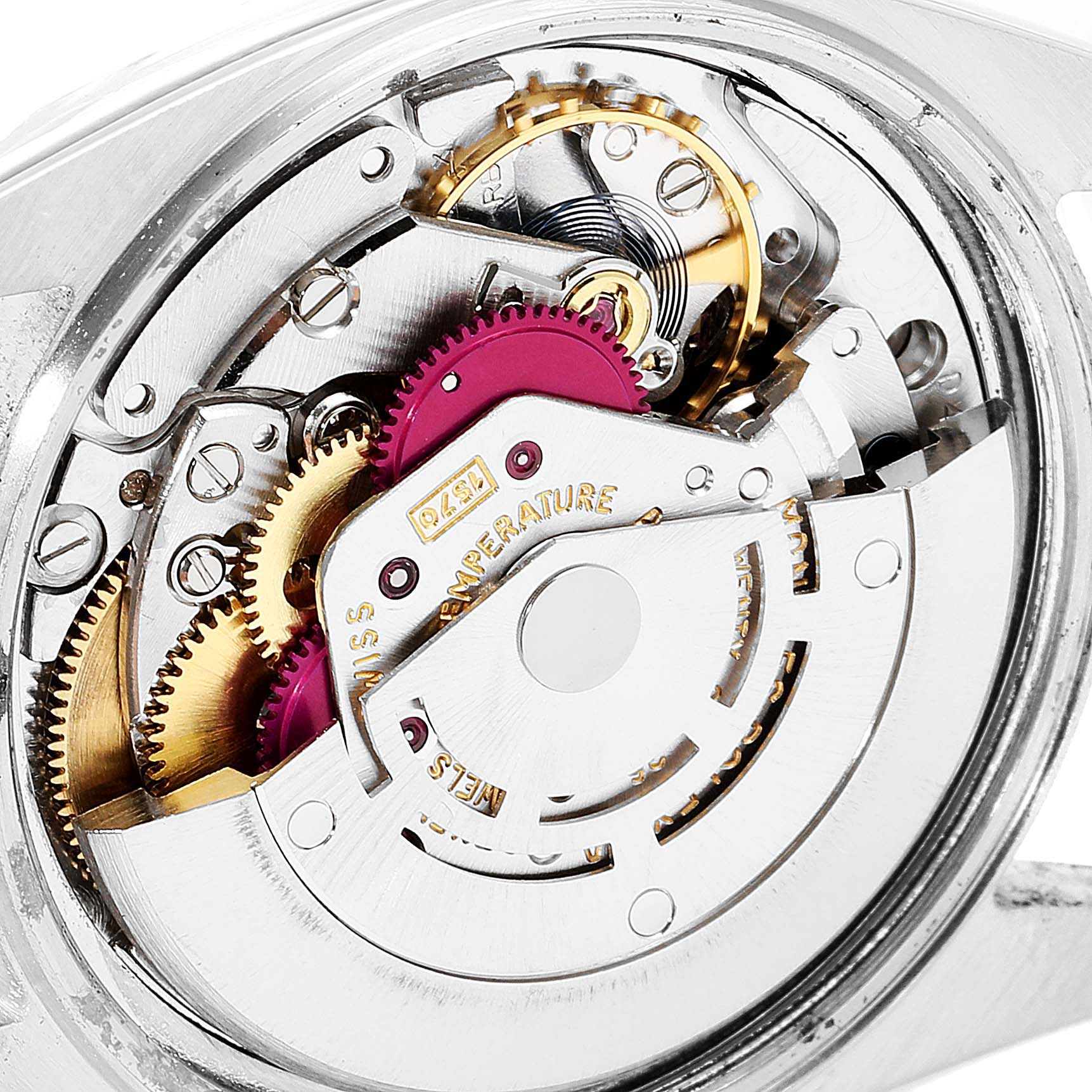 The image shows a close-up view of the movement mechanism in a Vintage Collection Rolex watch.