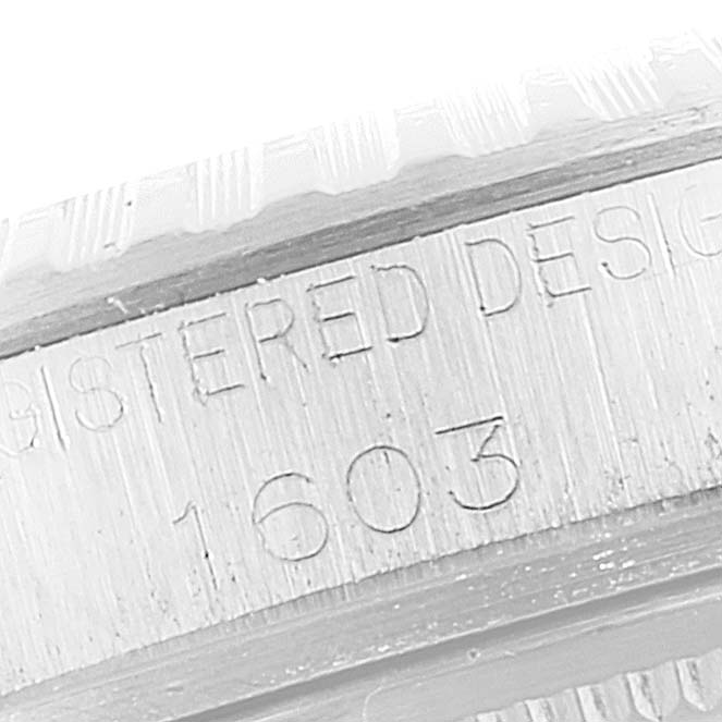 This close-up image of the Rolex Vintage Collection 1603 Men's Stainless Steel Silver Dial 1603 Men's Stainless Steel Silver Dial model shows the engraved serial number "1603" on its side.