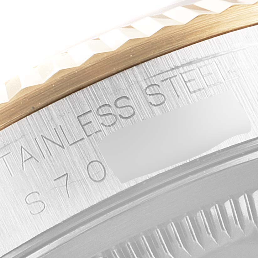 This close-up image shows the side profile, focusing on the fluted bezel and "STAINLESS STEEL" engraving of the Rolex Datejust 16233 Men's Steel and Gold (two tone) Grey Dial 16233 Men's Steel and Gold (two tone) Grey Dial.