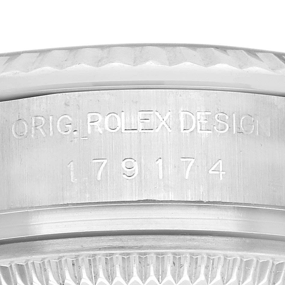 The image shows a close-up of the edge and casing inscription of the Rolex Cocktail 179174 Women
s Stainless Steel Silver Dial 179174 Women
s Stainless Steel Silver Dial watch.
