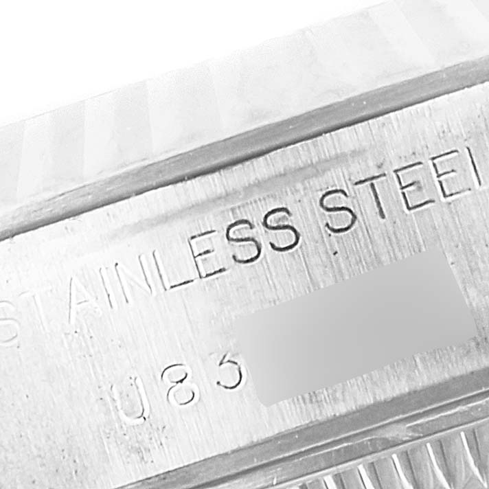 The image shows a close-up of the stainless steel engraving on the side of a Rolex Datejust 69174 Women's Stainless Steel Mother of Pearl Dial 69174 Women's Stainless Steel Mother of Pearl Dial watch case or bracelet.