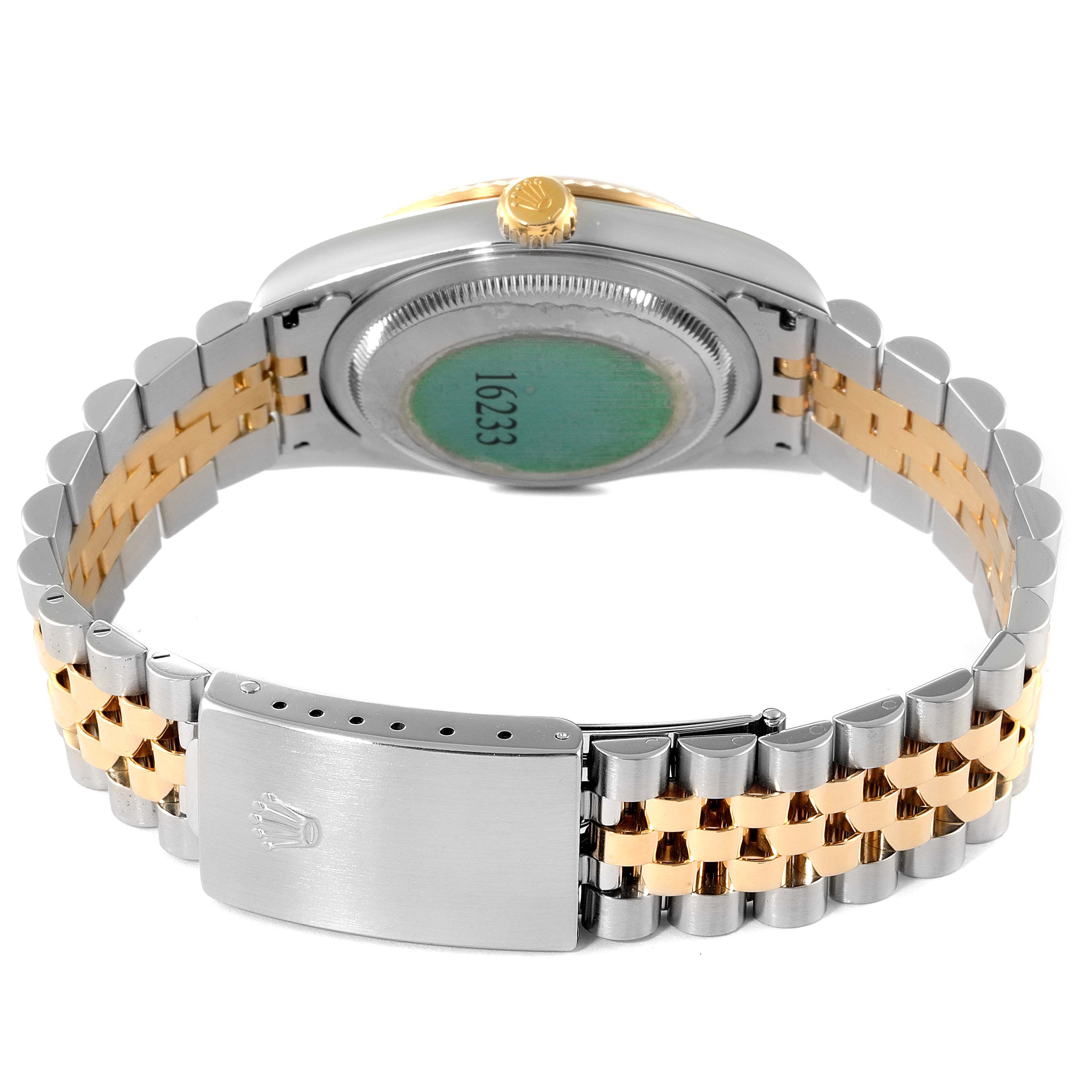 This image shows the back of a Rolex Datejust 16233 Men's Steel and Gold (two tone) Champagne Dial 16233 Men's Steel and Gold (two tone) Champagne Dial watch, focusing on the clasp, bracelet, and case back.