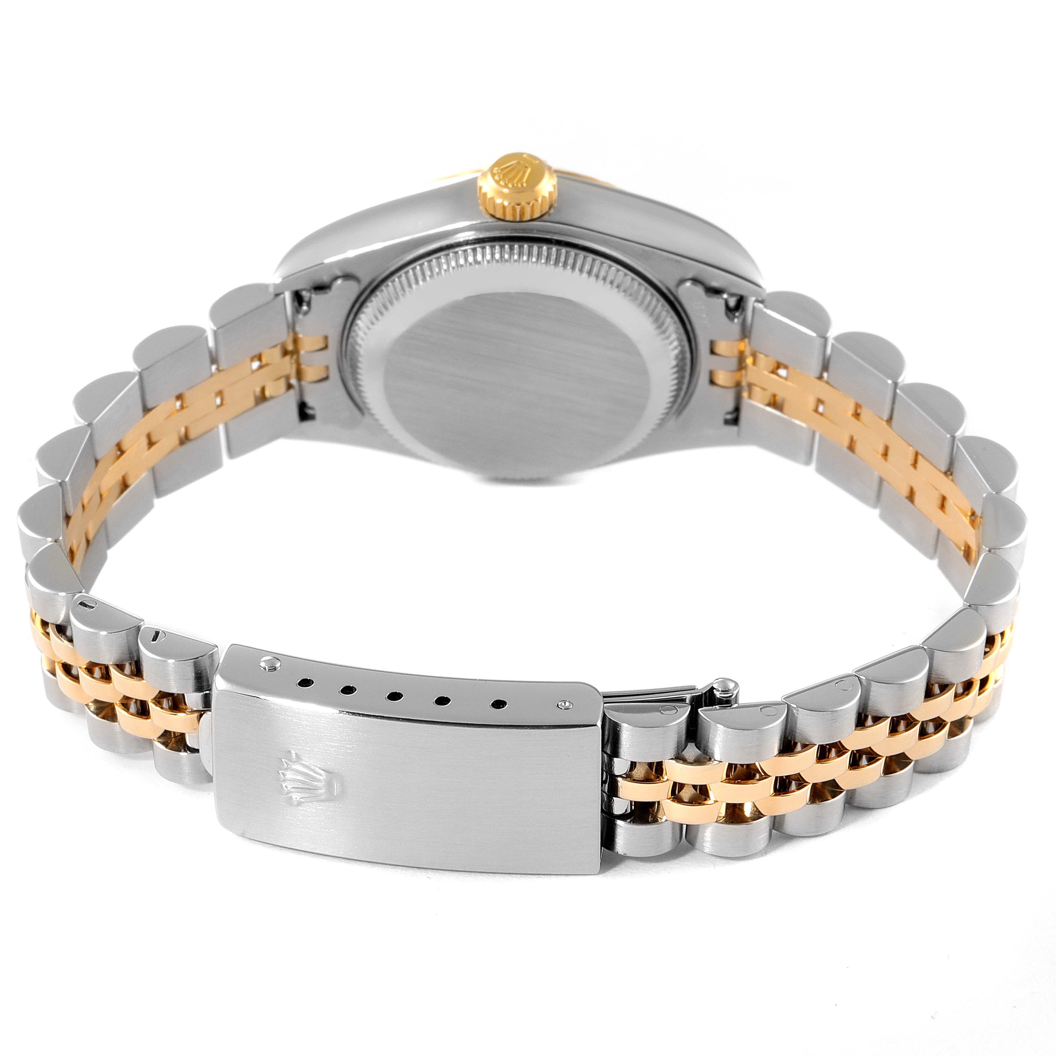 This image shows the back view of a Rolex Datejust 79173 Women
s Steel and Gold (two tone) Champagne Dial 79173 Women
s Steel and Gold (two tone) Champagne Dial watch, focusing on the case, crown, and two-tone bracelet with the clasp.