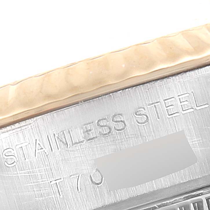 This close-up image shows the stainless steel engraving and part of the bezel on a Rolex Datejust 69173 Women's Steel and Gold (two tone) Beige Dial 69173 Women's Steel and Gold (two tone) Beige Dial watch.