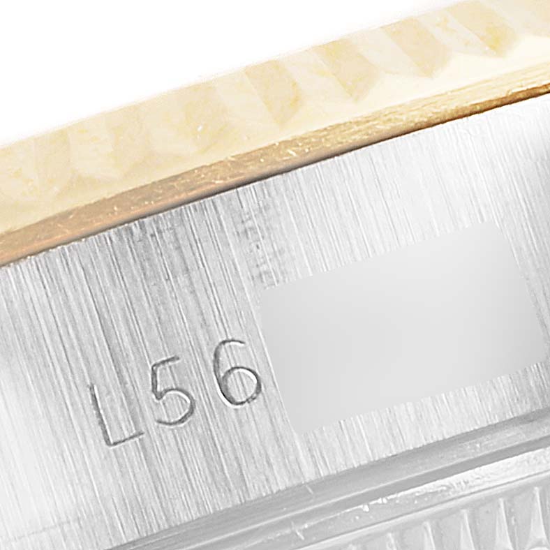 This image shows a close-up of the case and bezel of a Rolex Datejust 69173 Women's Steel and Gold (two tone) Champagne Dial 69173 Women's Steel and Gold (two tone) Champagne Dial watch, revealing part of the serial number.