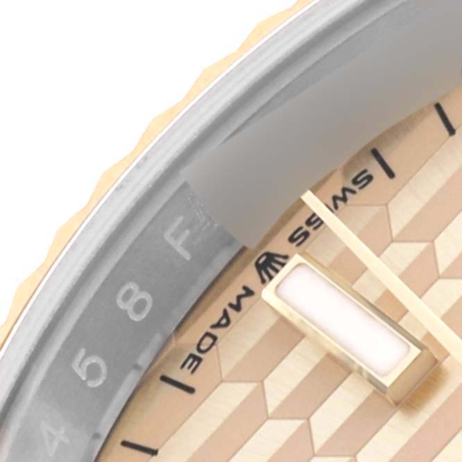 The image shows a close-up of the Rolex Datejust 126233 Men's Steel and Gold (two tone) Champagne Dial 126233 Men's Steel and Gold (two tone) Champagne Dial watch face, highlighting the textured dial and partial bezel.