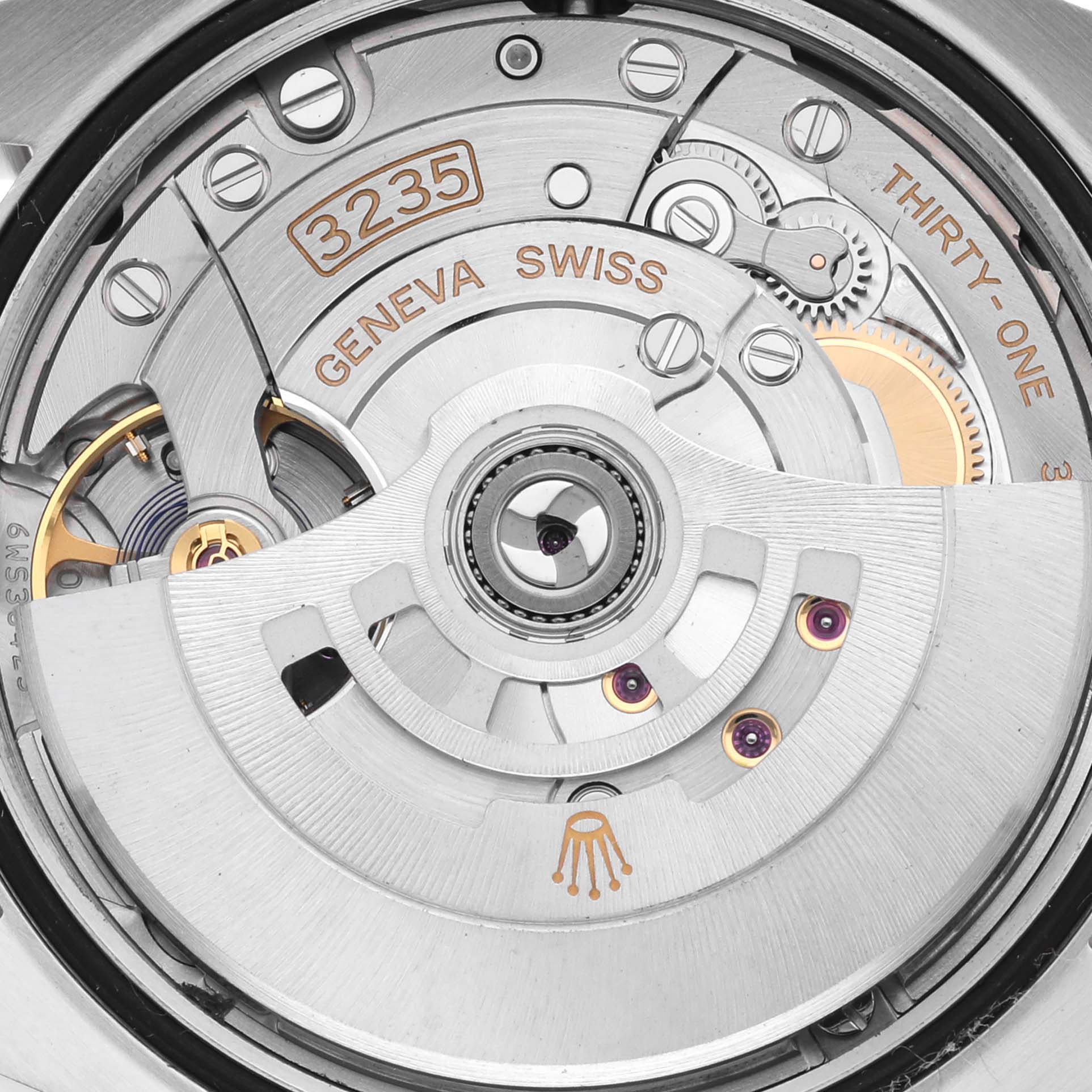 The image shows the movement mechanism of the Rolex Datejust 126233 Men's Steel and Gold (two tone) Champagne Dial 126233 Men's Steel and Gold (two tone) Champagne Dial, focusing on the intricate internal parts like gears and rotors.